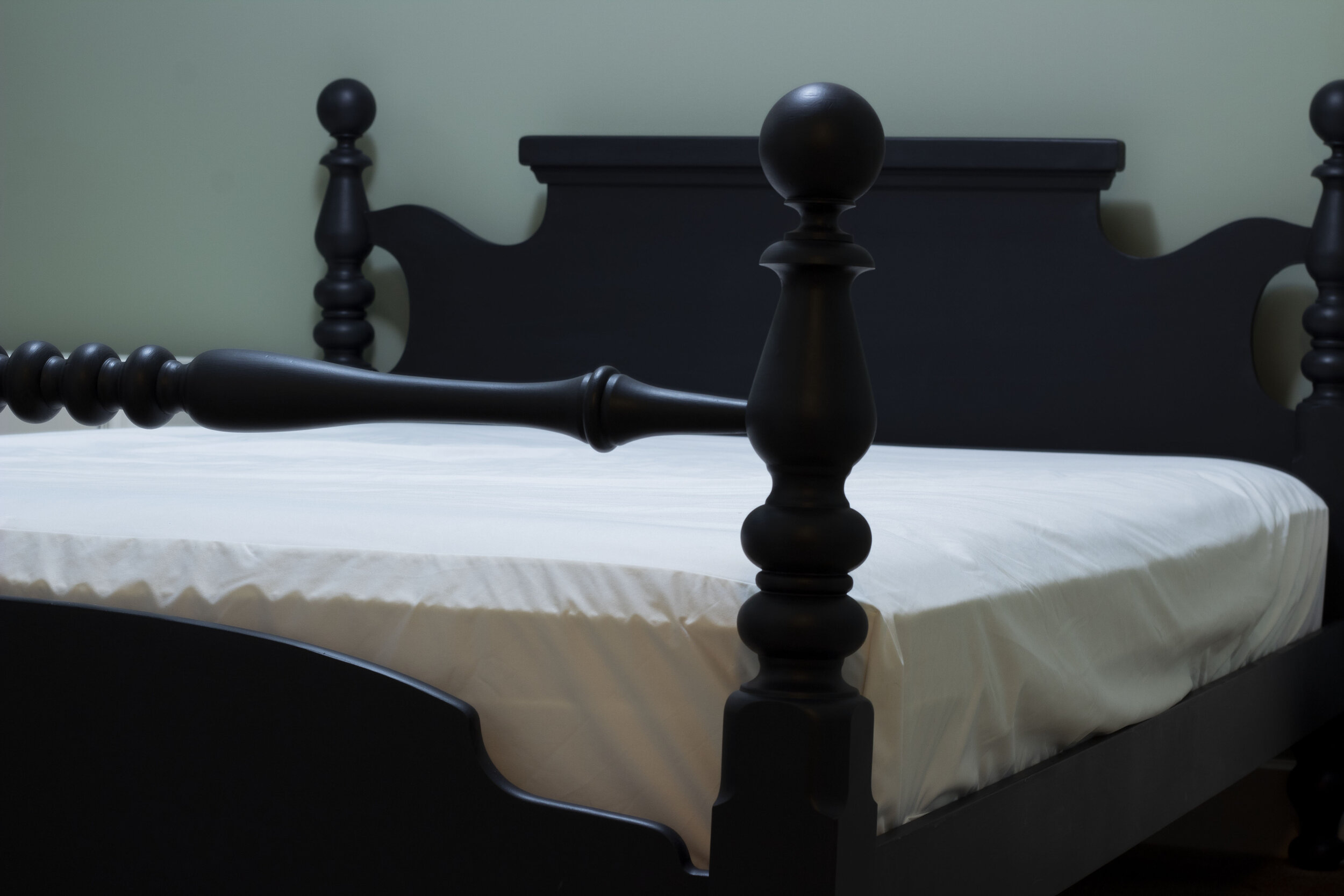 Antique spindle bed painted black