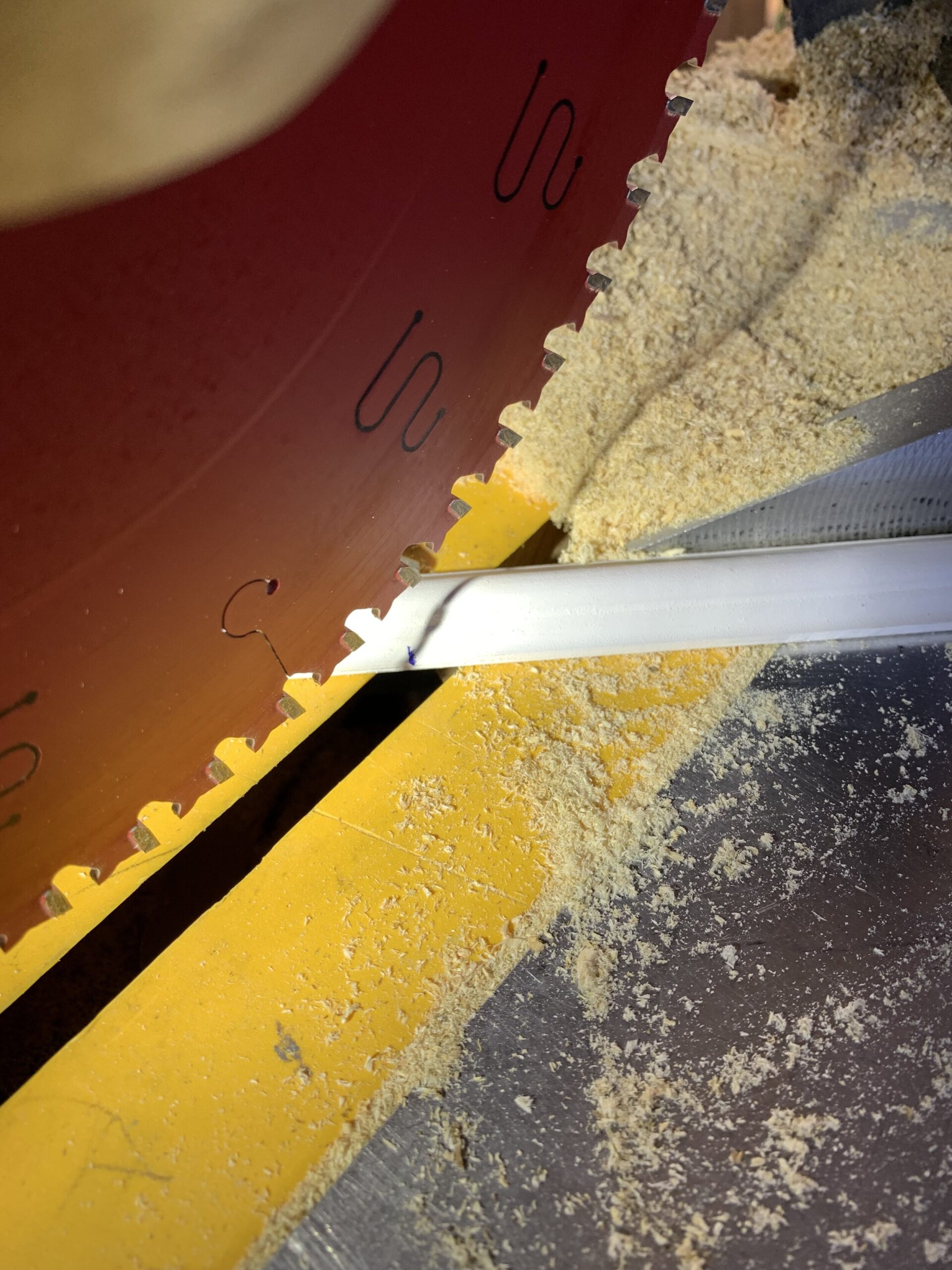 Cutting a piece of trim to 45 degrees on a mitre saw