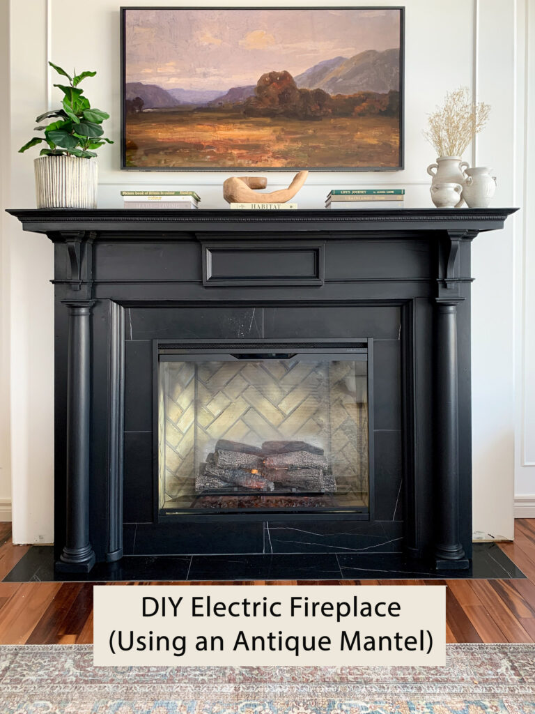 black antique fireplace mantel with black marble surround with graphic indicating "DIY electric fireplace (using an Antique Mantel"
