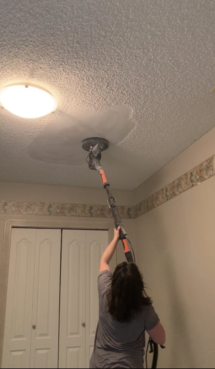 Removing popcorn ceiling with a drywall sander