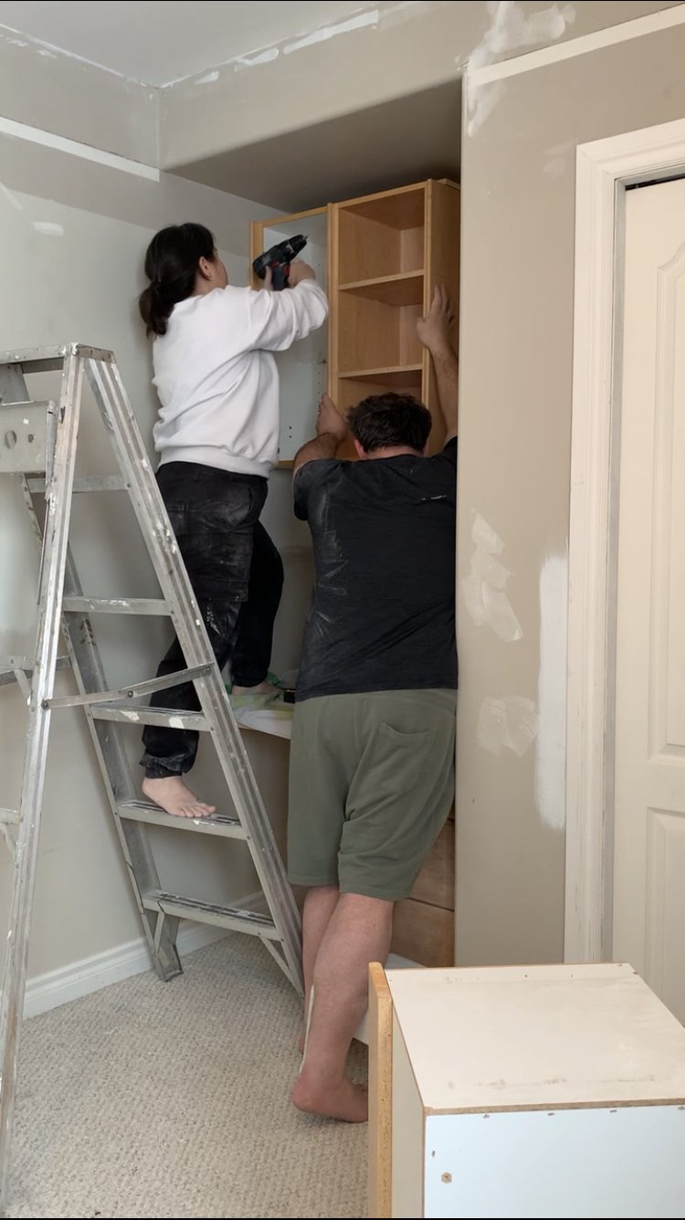 Installing cabinets in a bedroom nook