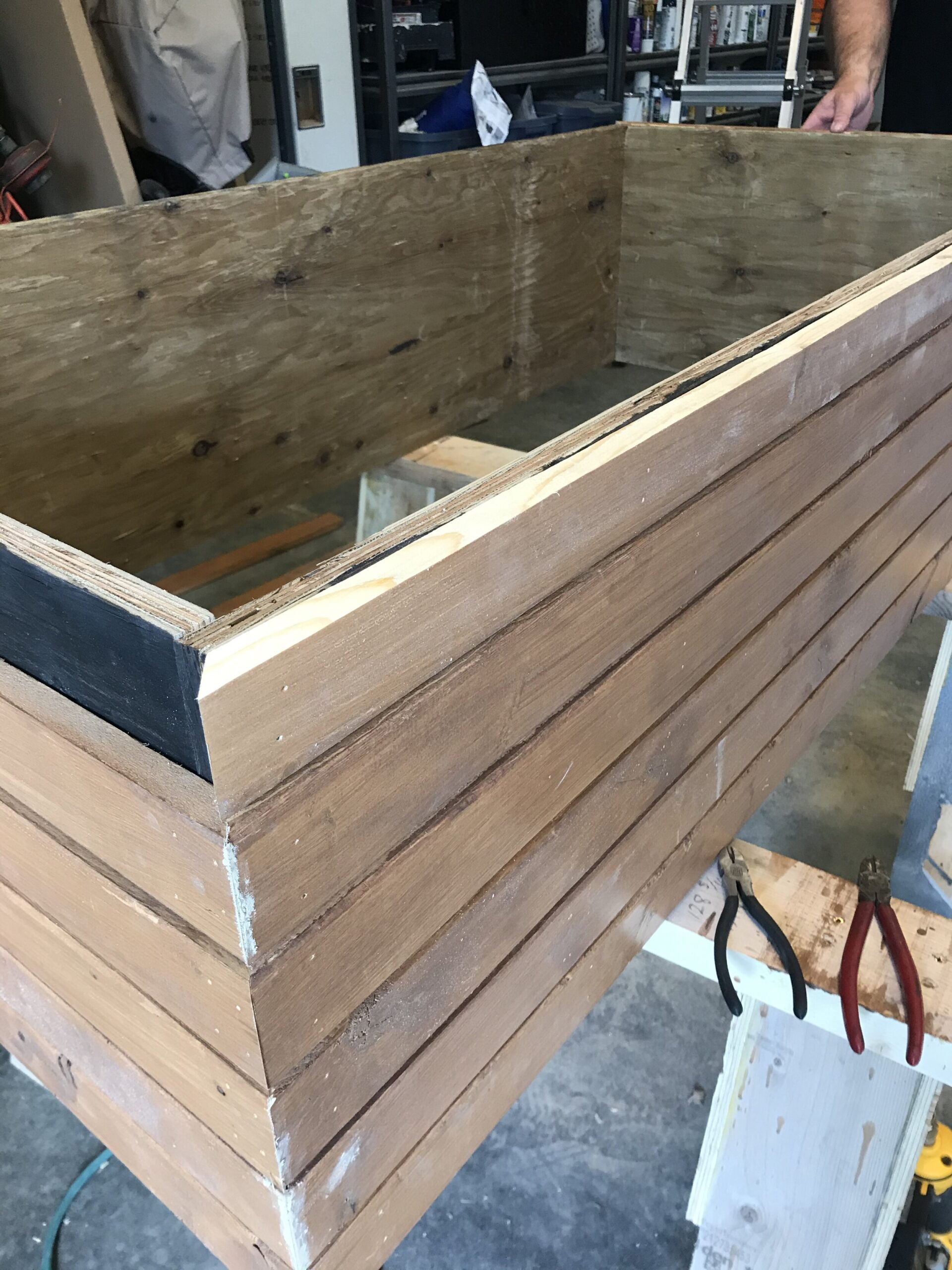 plywood box with slats placed on it with the top board cut down to fit