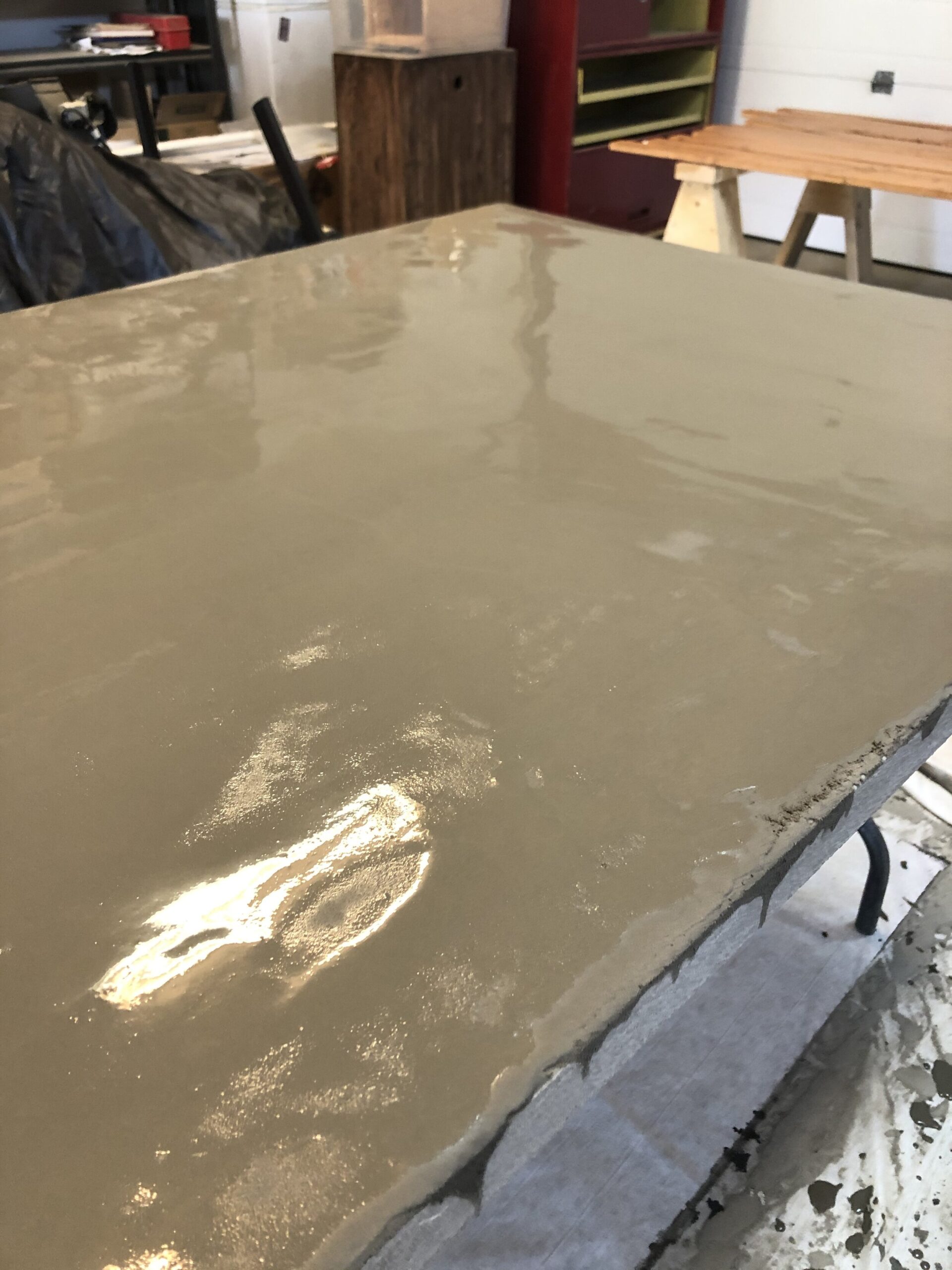 self leveling concrete on table top still wet