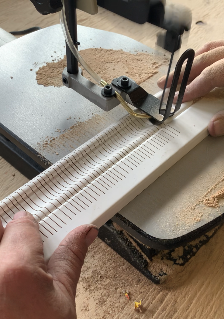 Cutting slits in moulding on a scroll saw