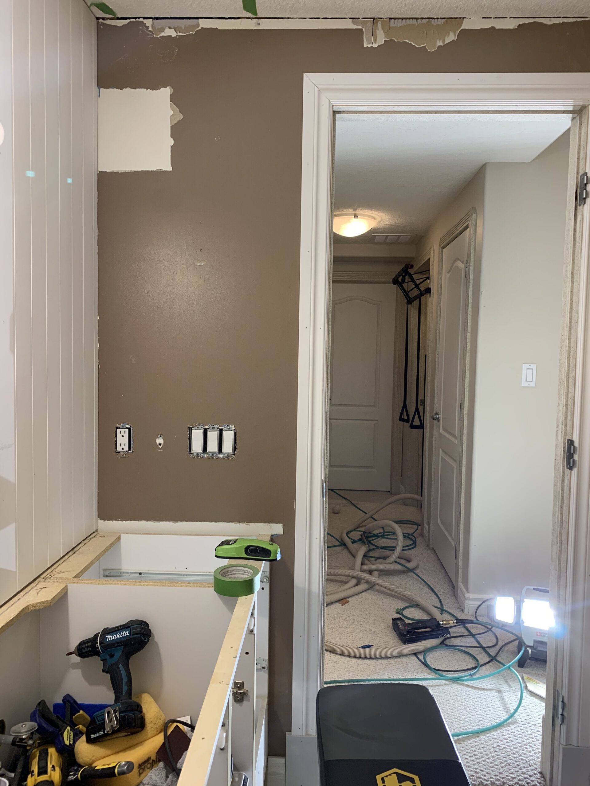 Wall where paneling needed to be cut around door and vanity