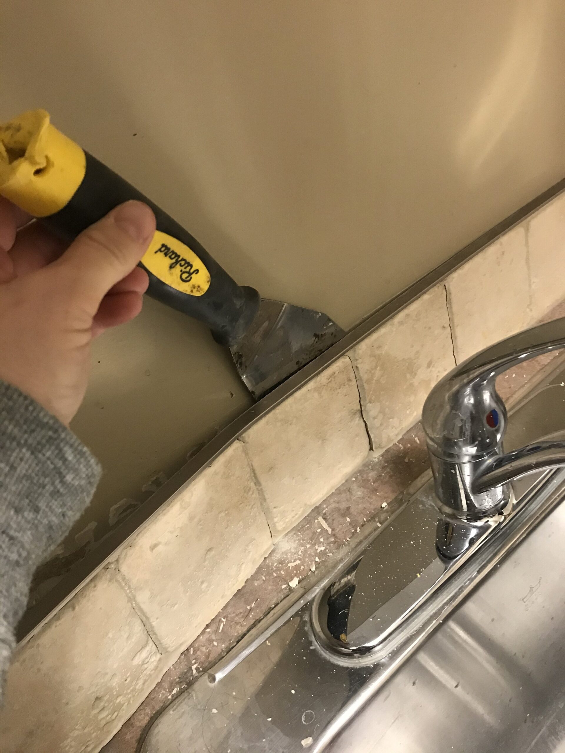 Prying single row of tile off the wall 