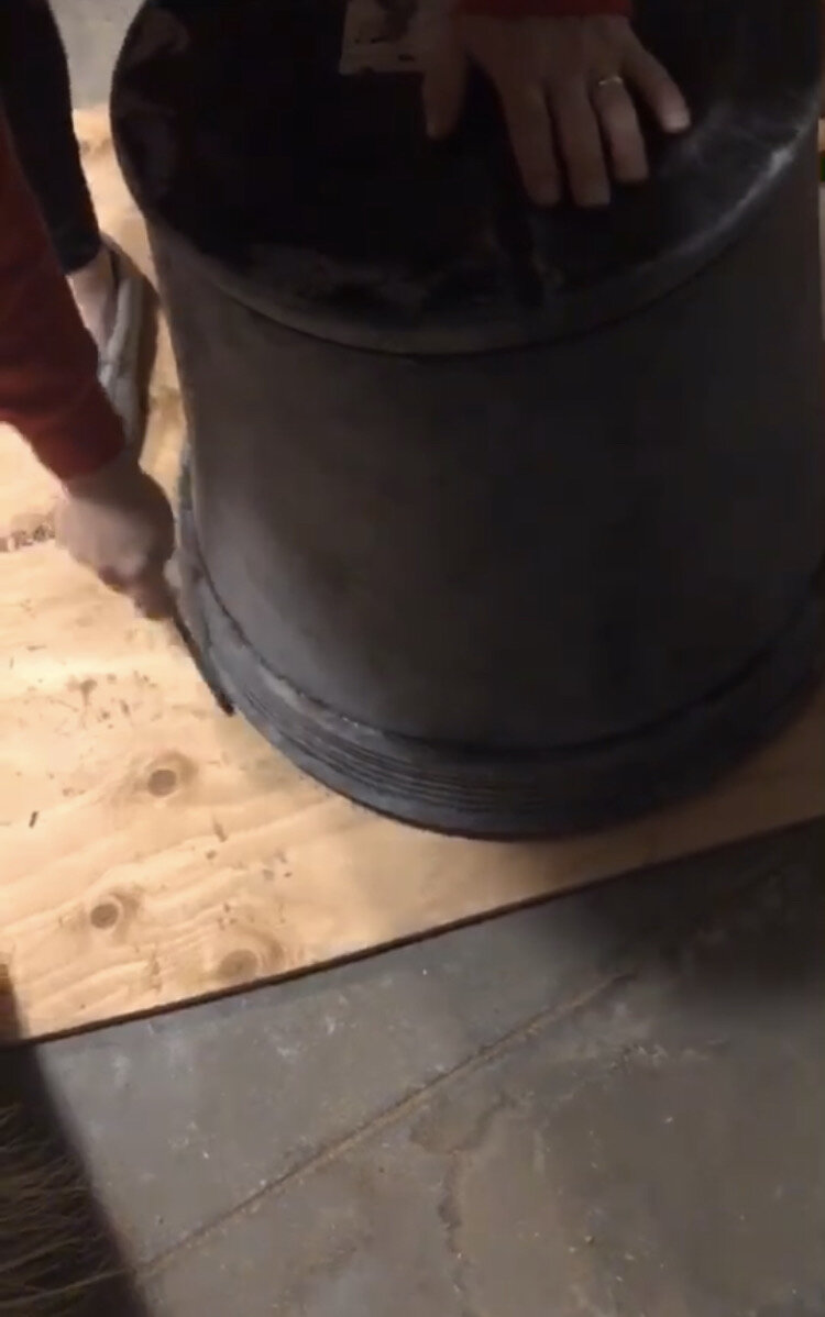 using a flower pot face down on a piece of plywood as a template to cut a circle