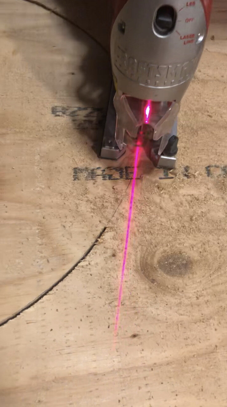 cutting a circle out of plywood with a jigsaw