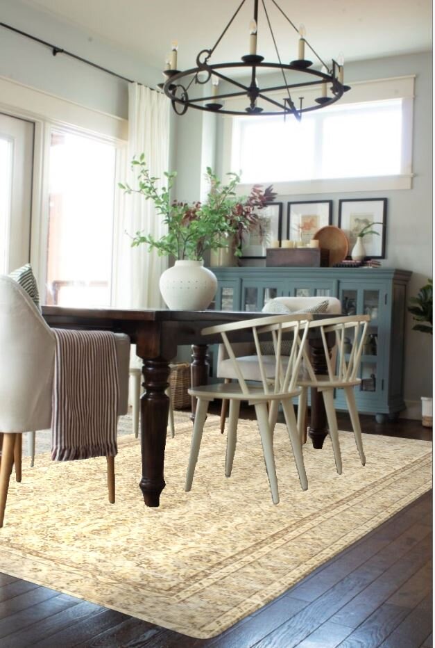 dining room with wood table, modern white chairs, blue sideboard, large windows with a virtual image of a vintage beige rug under the table