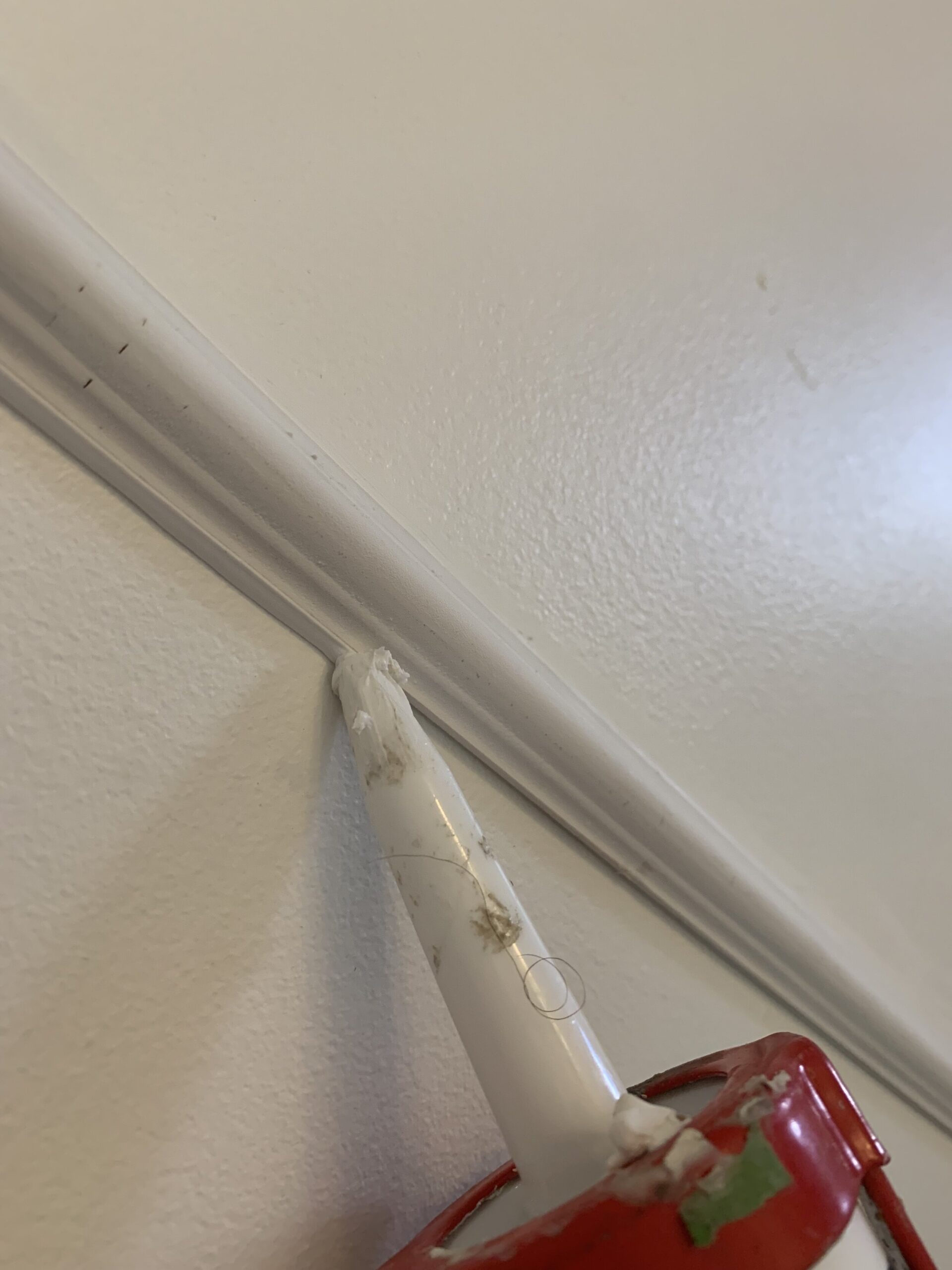 Caulking the edged of the moulding