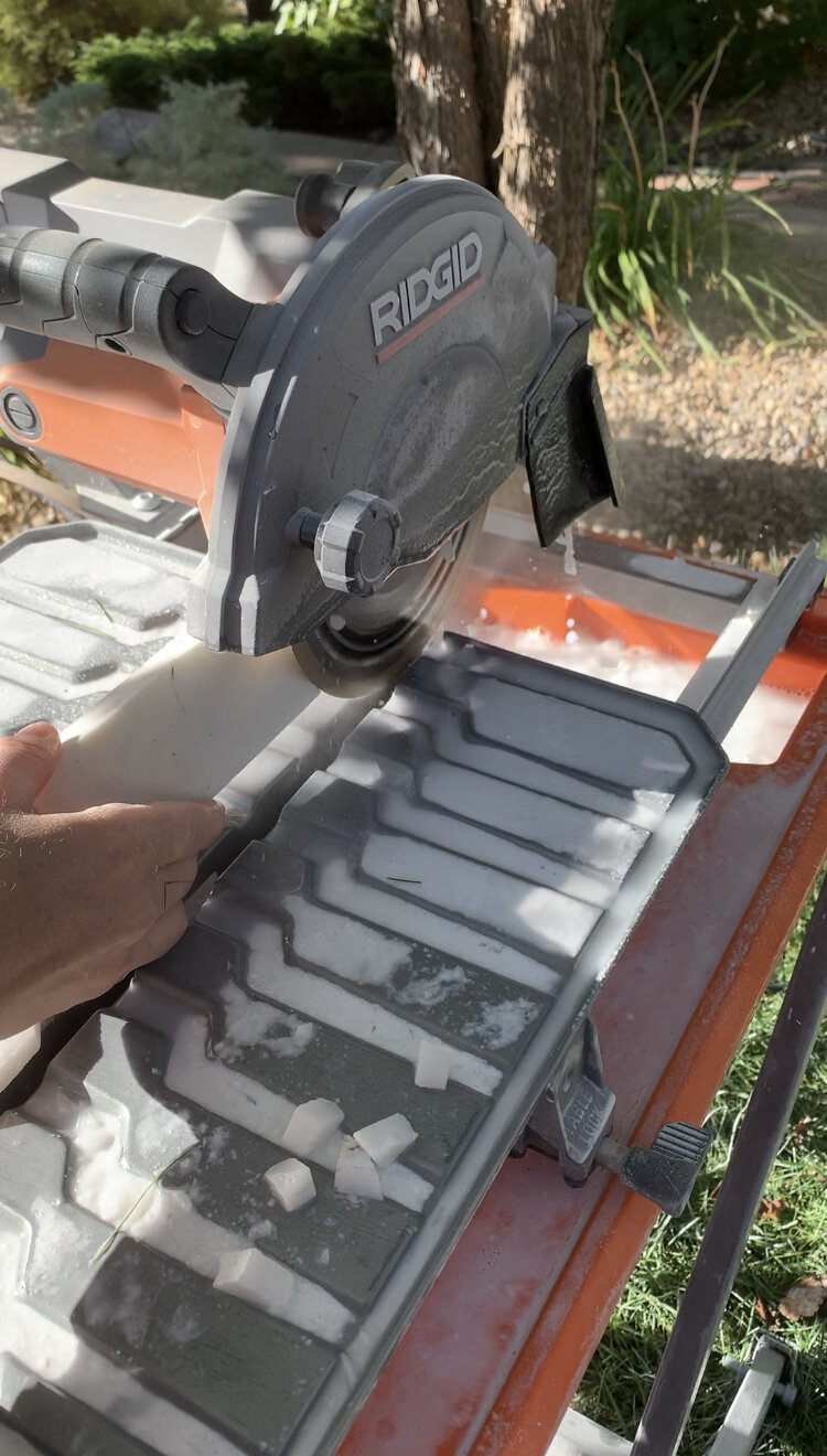 using a sharpening stone to keep the tile cutting blade sharp