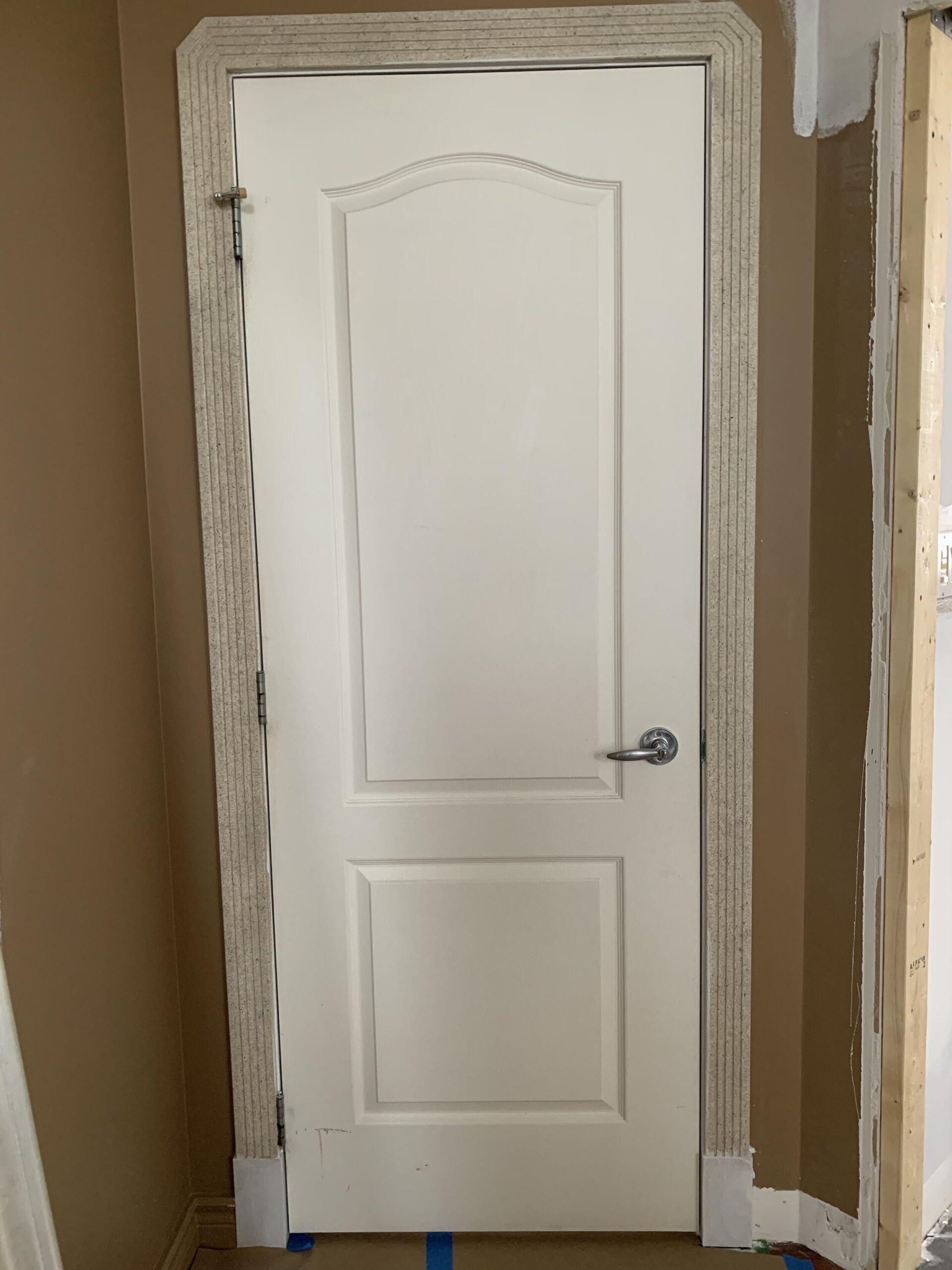 Door with beige textured trim 