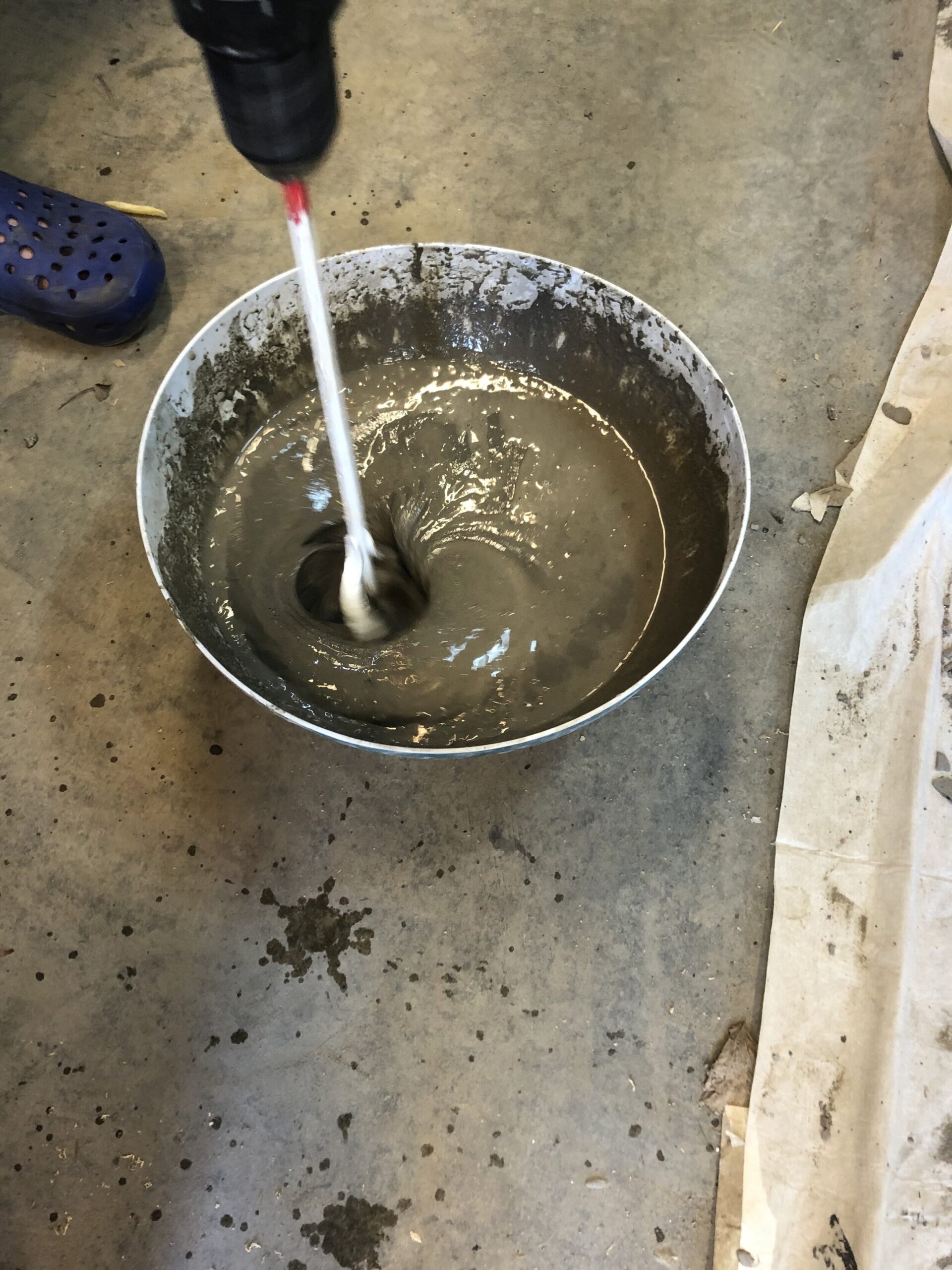 mixing concrete in a bucket