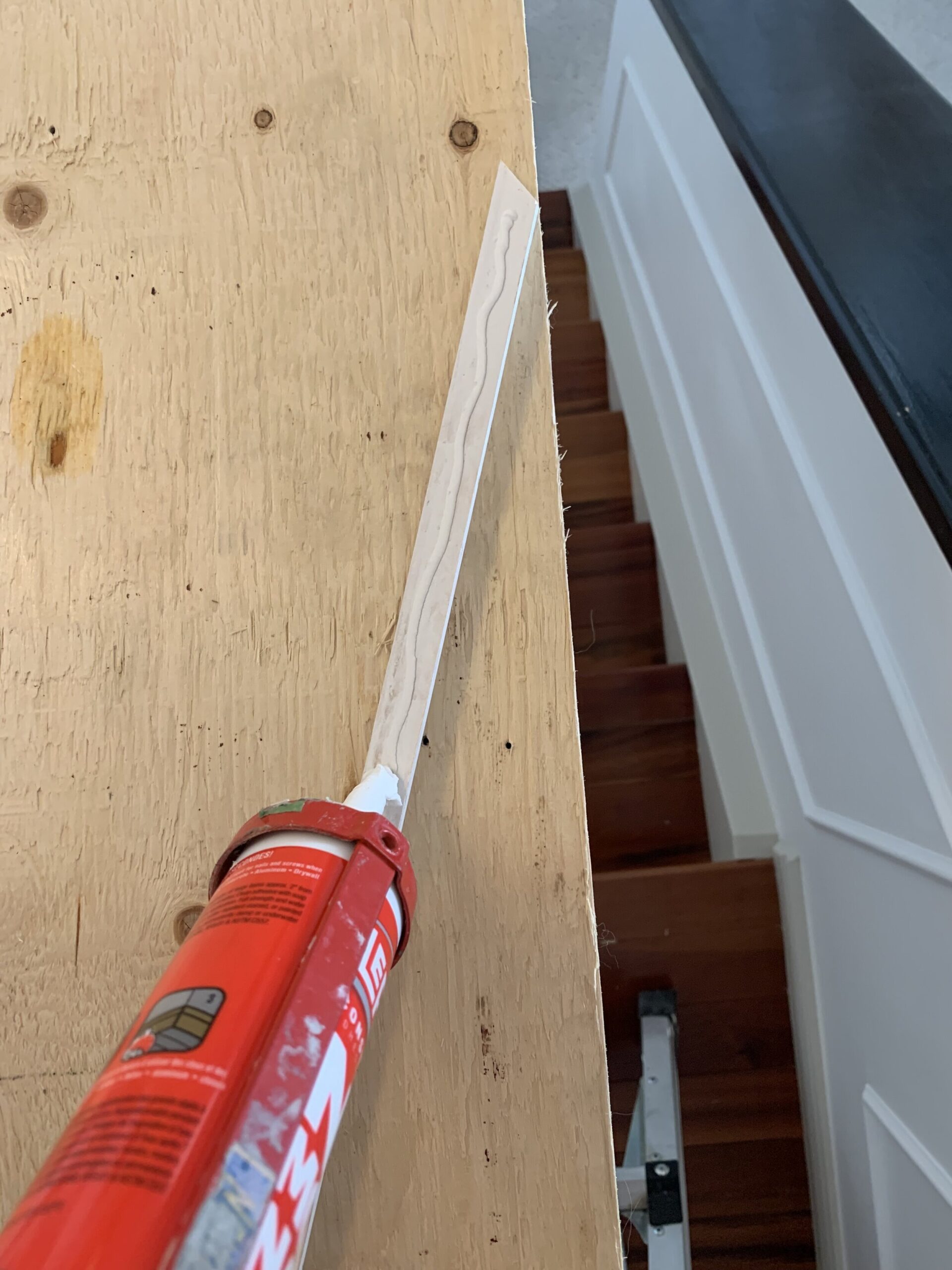 Adding no more nails adhesive to the back of a piece of moulding