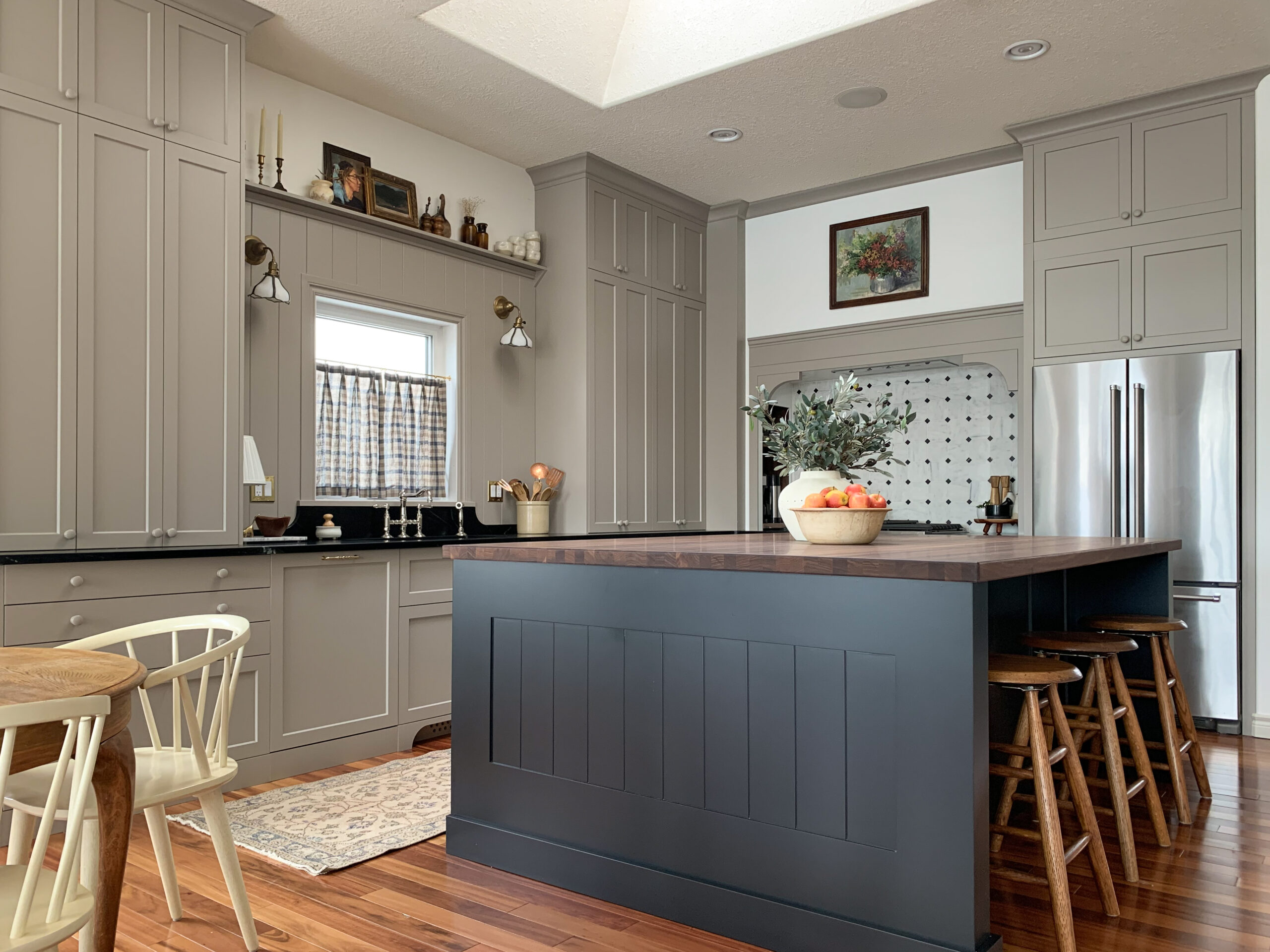 Modern Traditional Kitchen with Beige and black cabinets, tongue and groove backspash, walnut butcher block, soapstone and marble backsplash