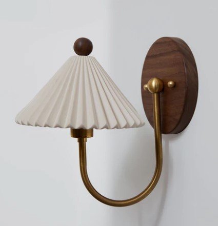 Product image of wood, brass sconces with ceramic pleated shade