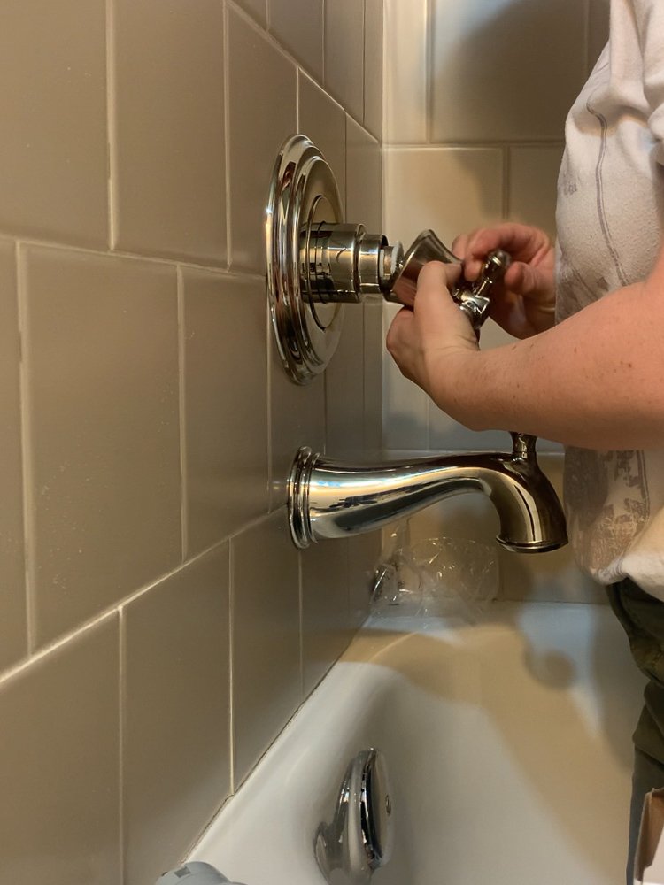 Adding a handle to the tub fixture