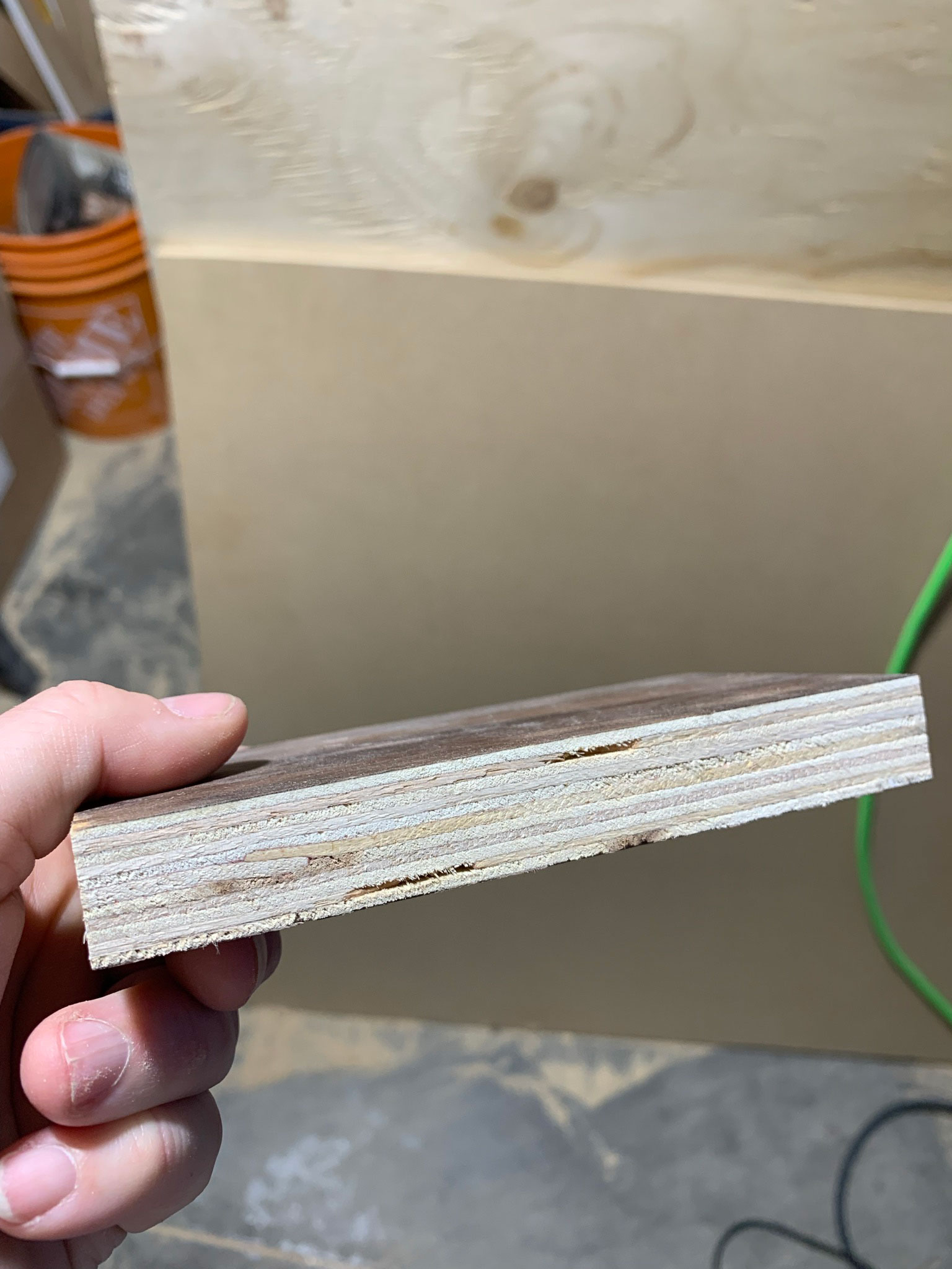 Walnut plywood edge without veneer showing the layers of wood glued together