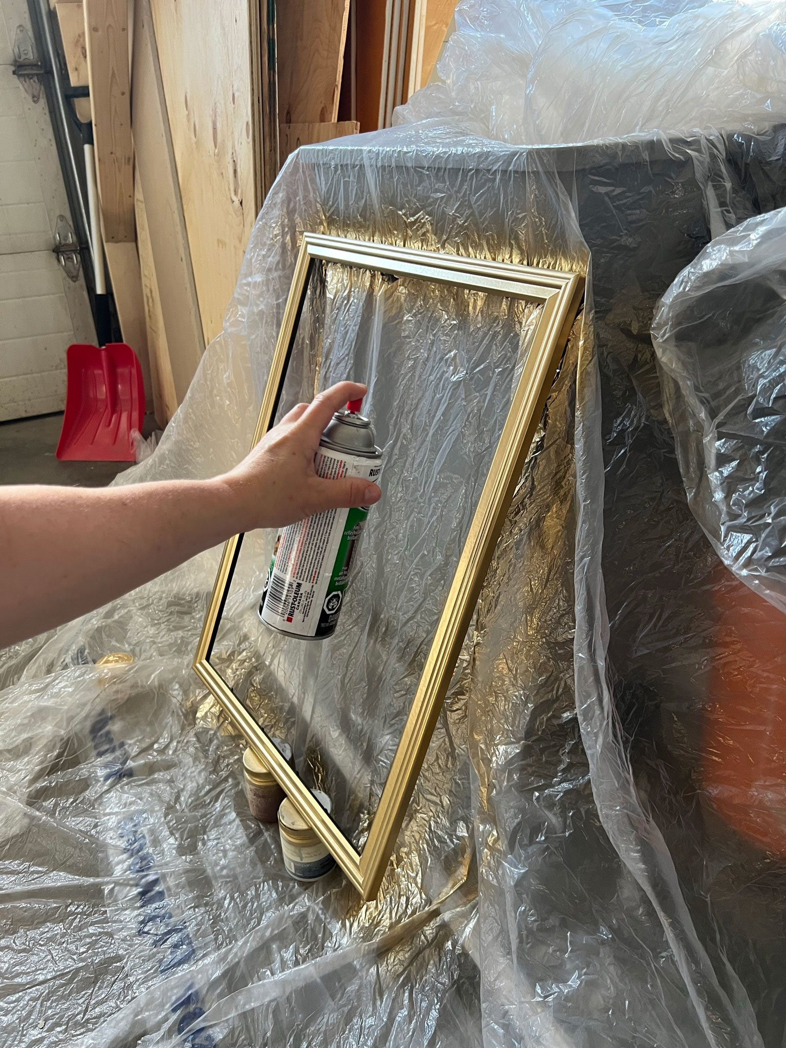 Spray painting a frame gold
