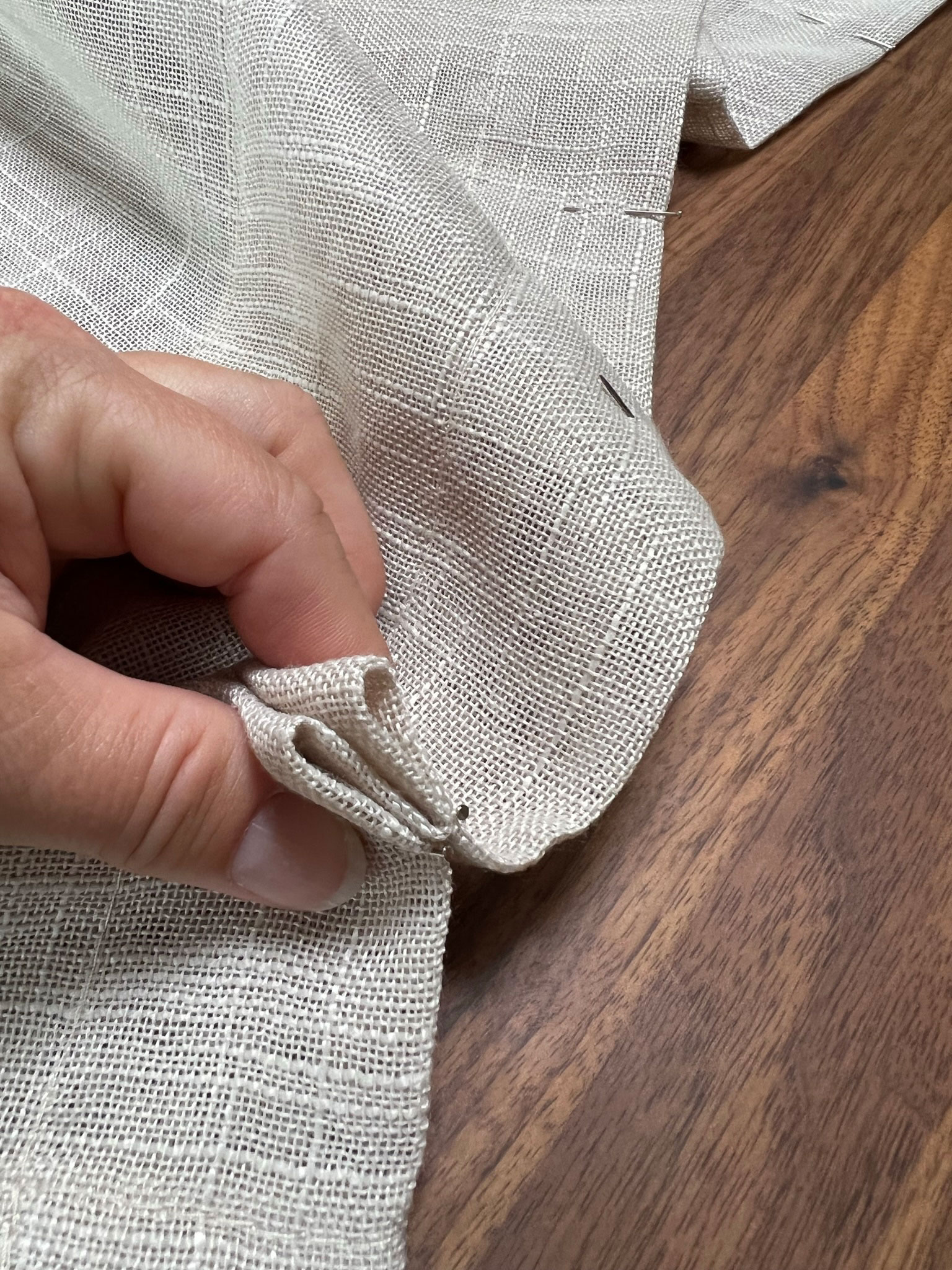 holding folded fabric in a double pleat