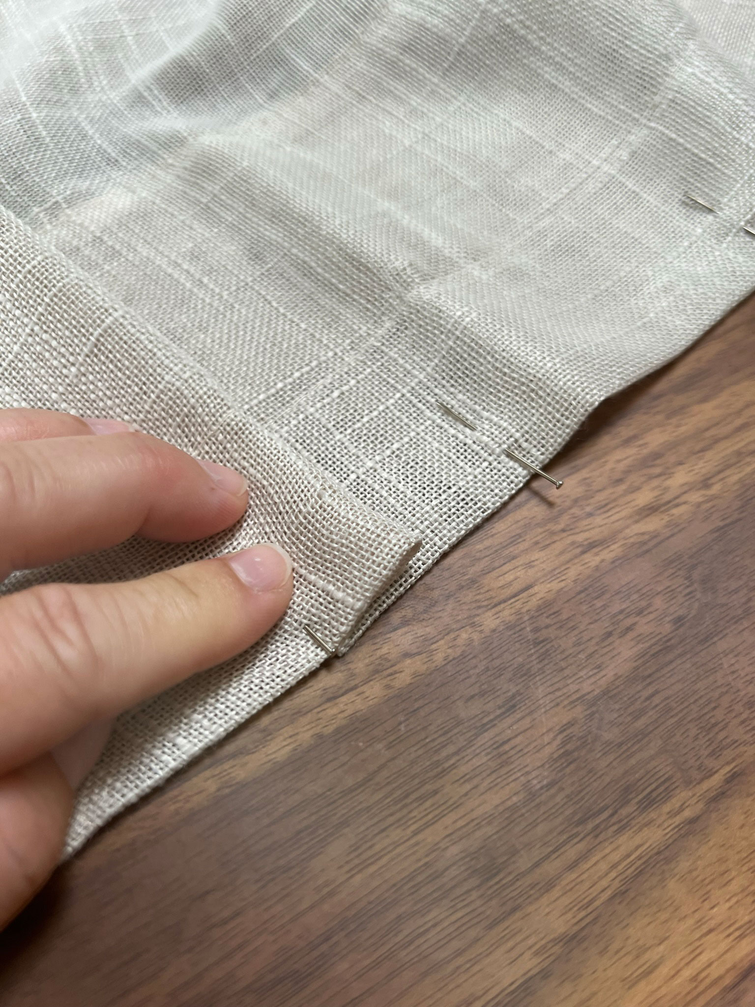Folding fabric back again to make a pleat