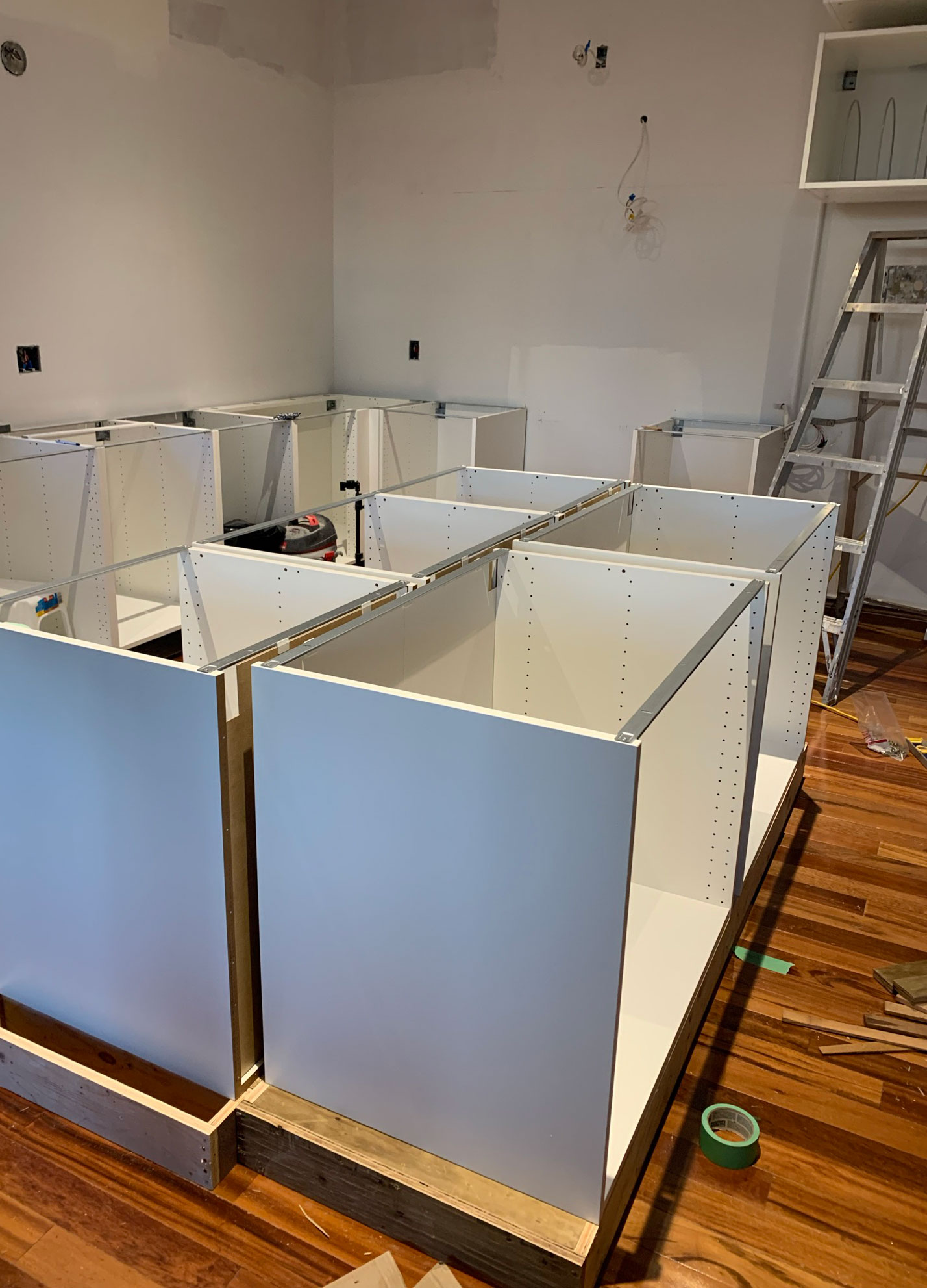 cabinet boxes sitting on a plywood base