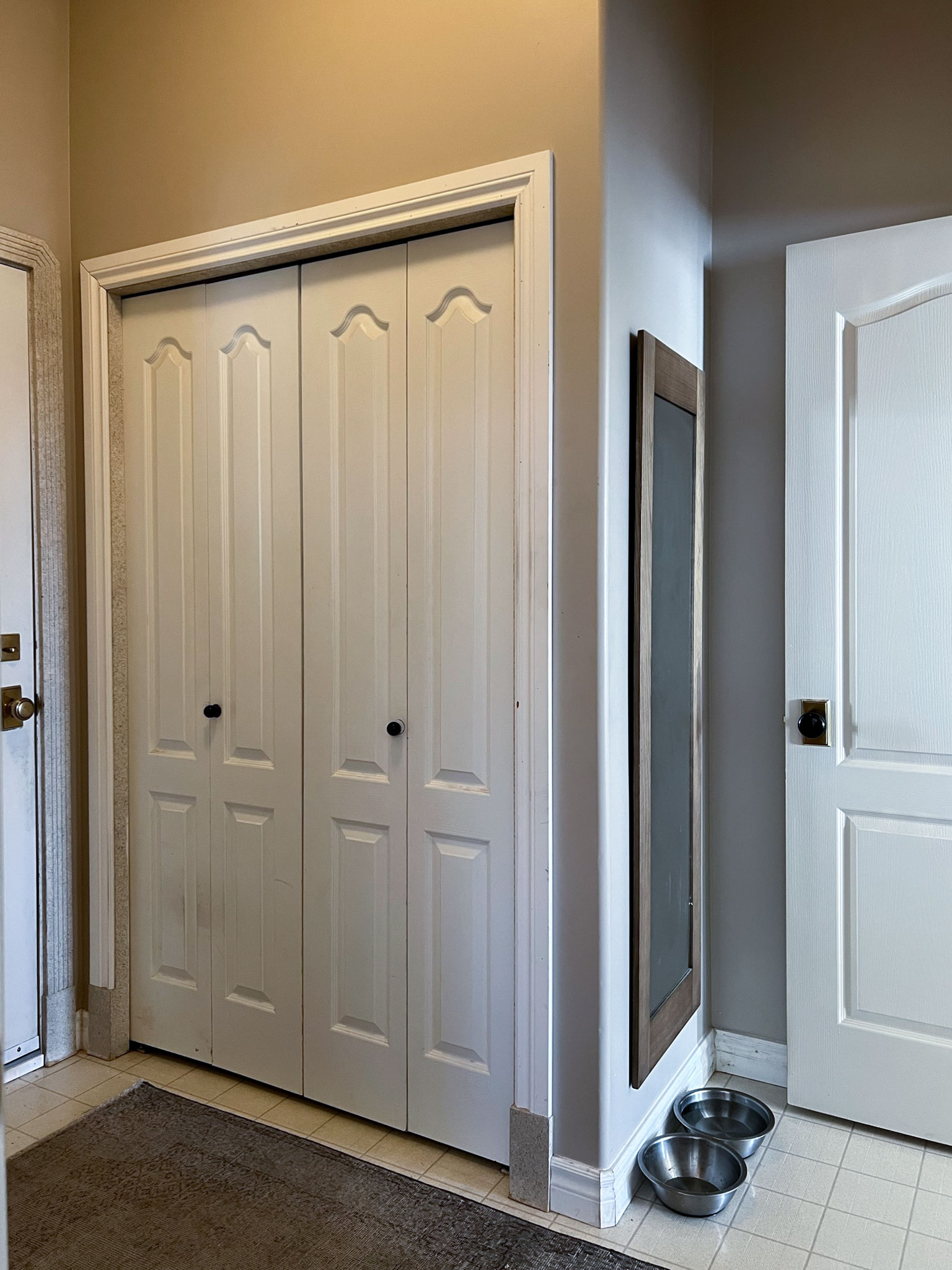 closet bump out on a wall with mirror on the side wall. mudroom before