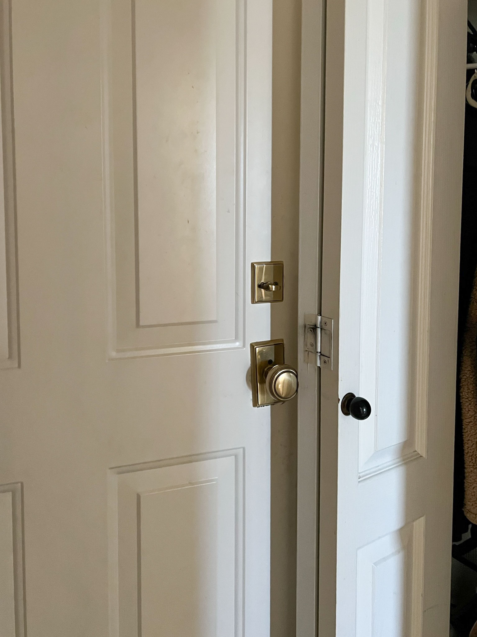 bifold closet door open and garage door hitting closet