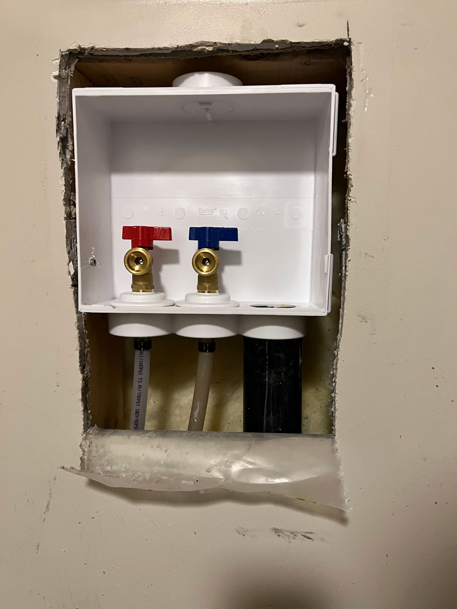 Drywall removed from below a plumbing box, new plubming box installed