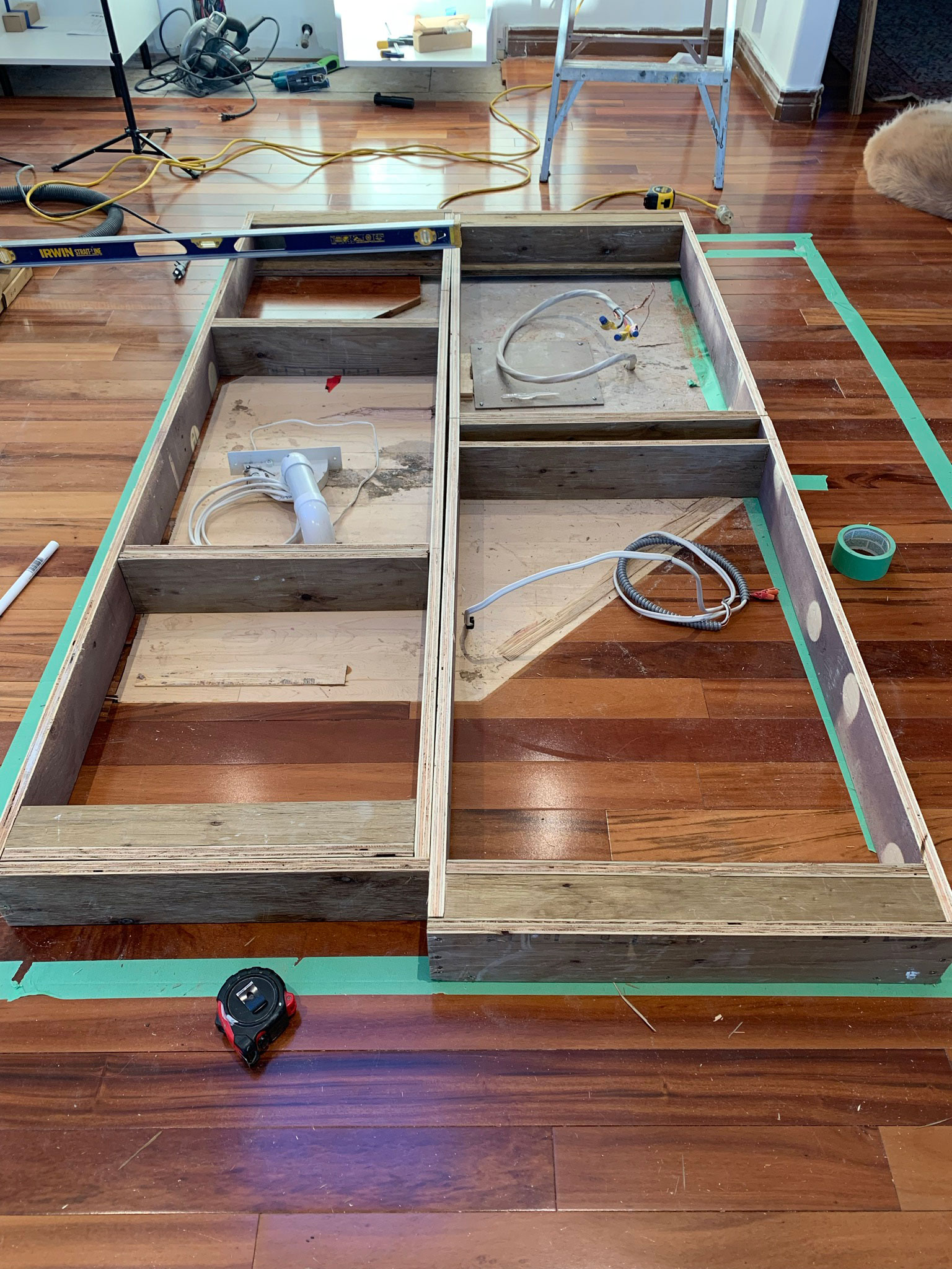 Plywood framing for base cabinets sitting on the floor