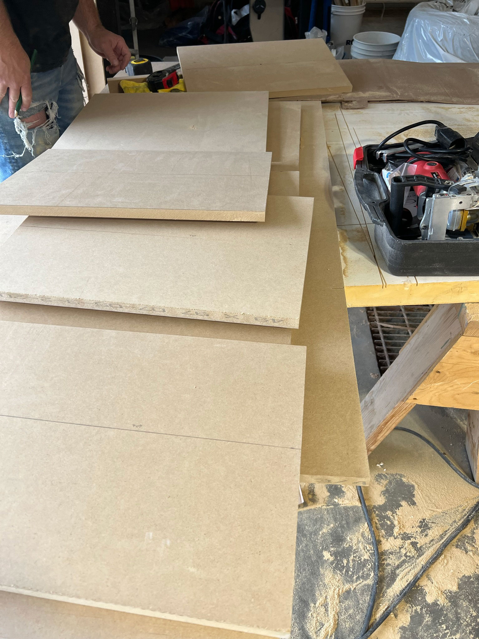 pieces cut out for bench seat in a pile