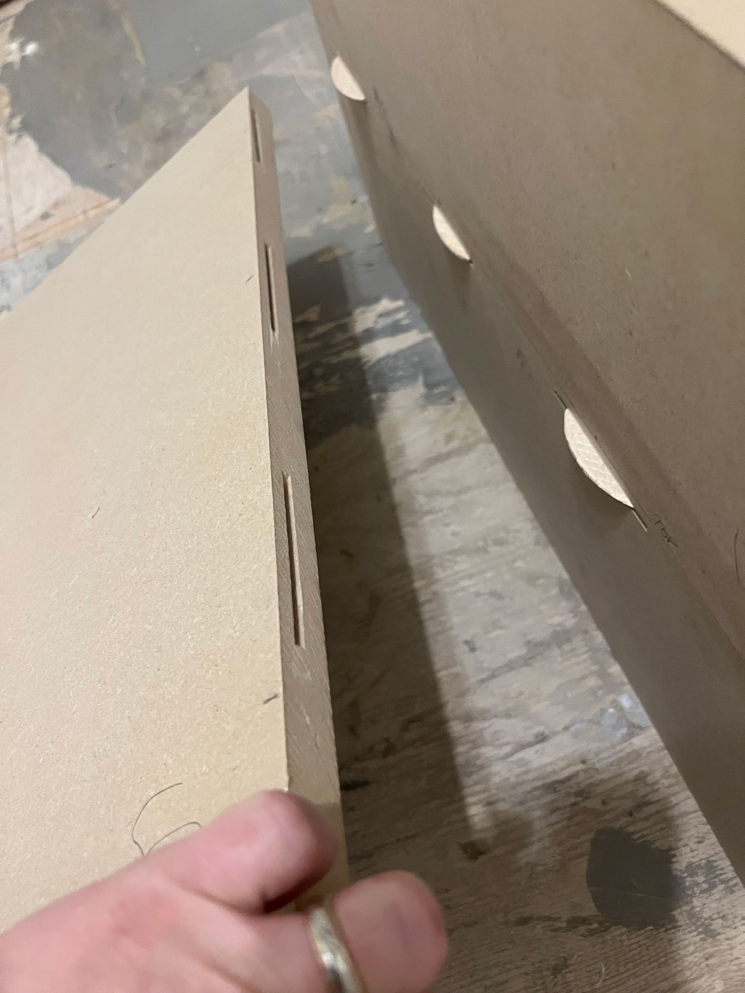 showing two sides of a buscuit joint with the buscuit side and the slots