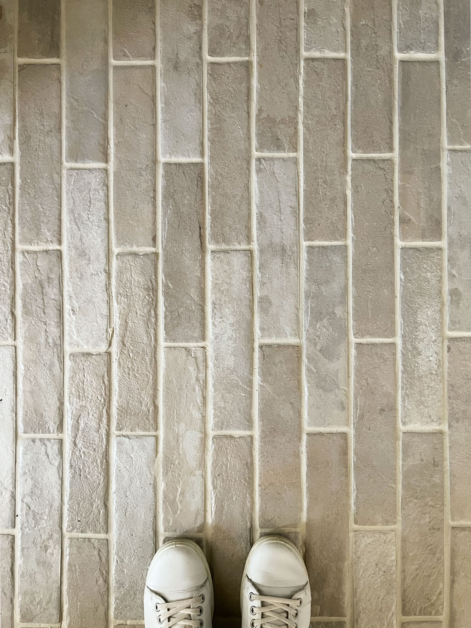 beige brick floors looking down