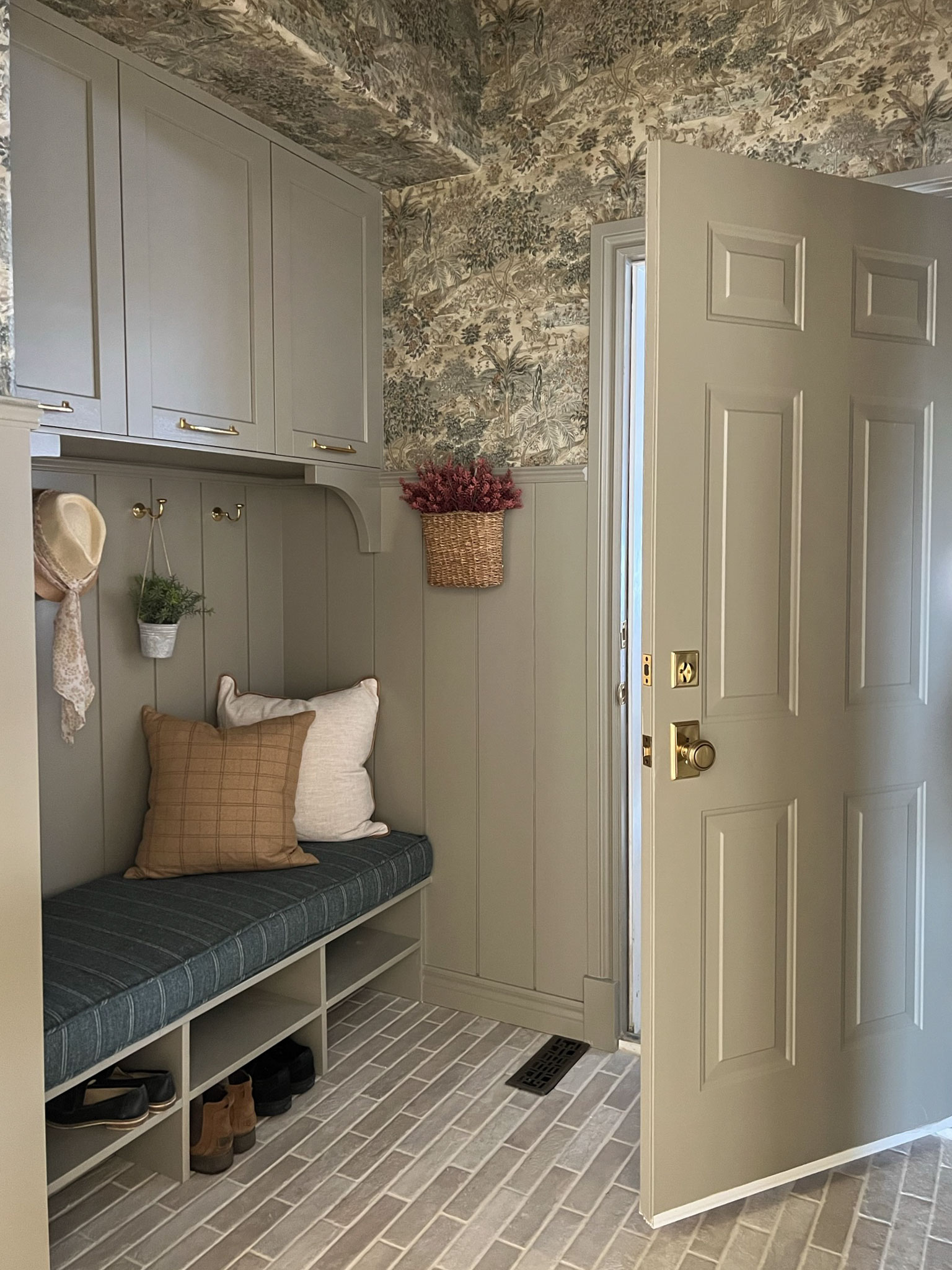 Door open towards bench in mudroom