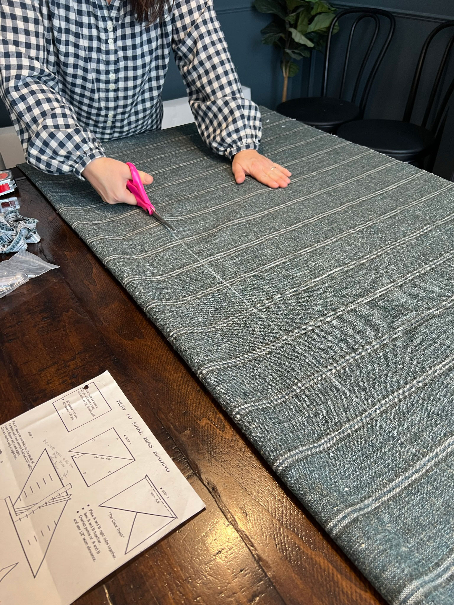 Cutting fabric along a line that is drawn on fabric