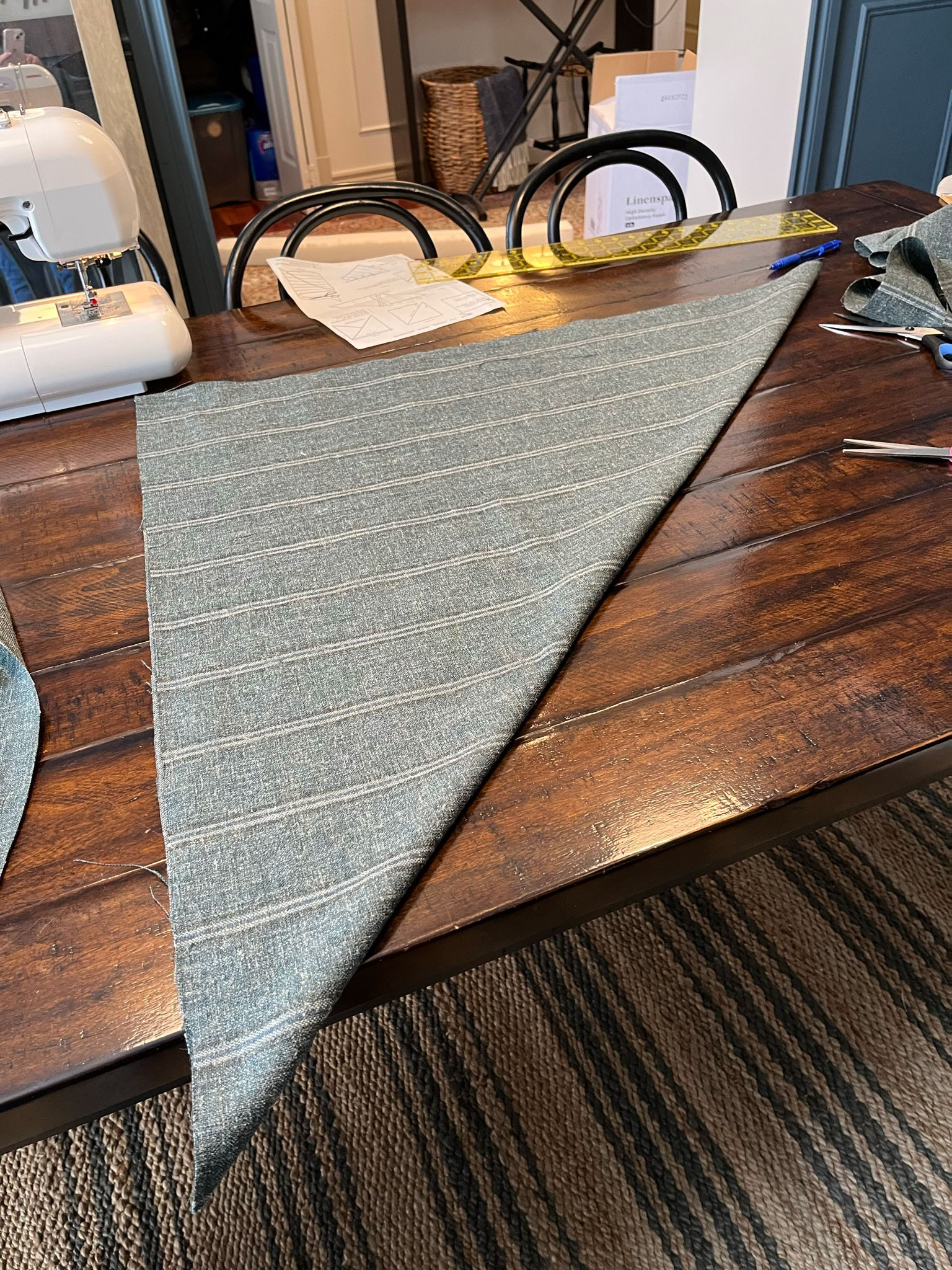 square of fabric folded diagonally to form a triangle
