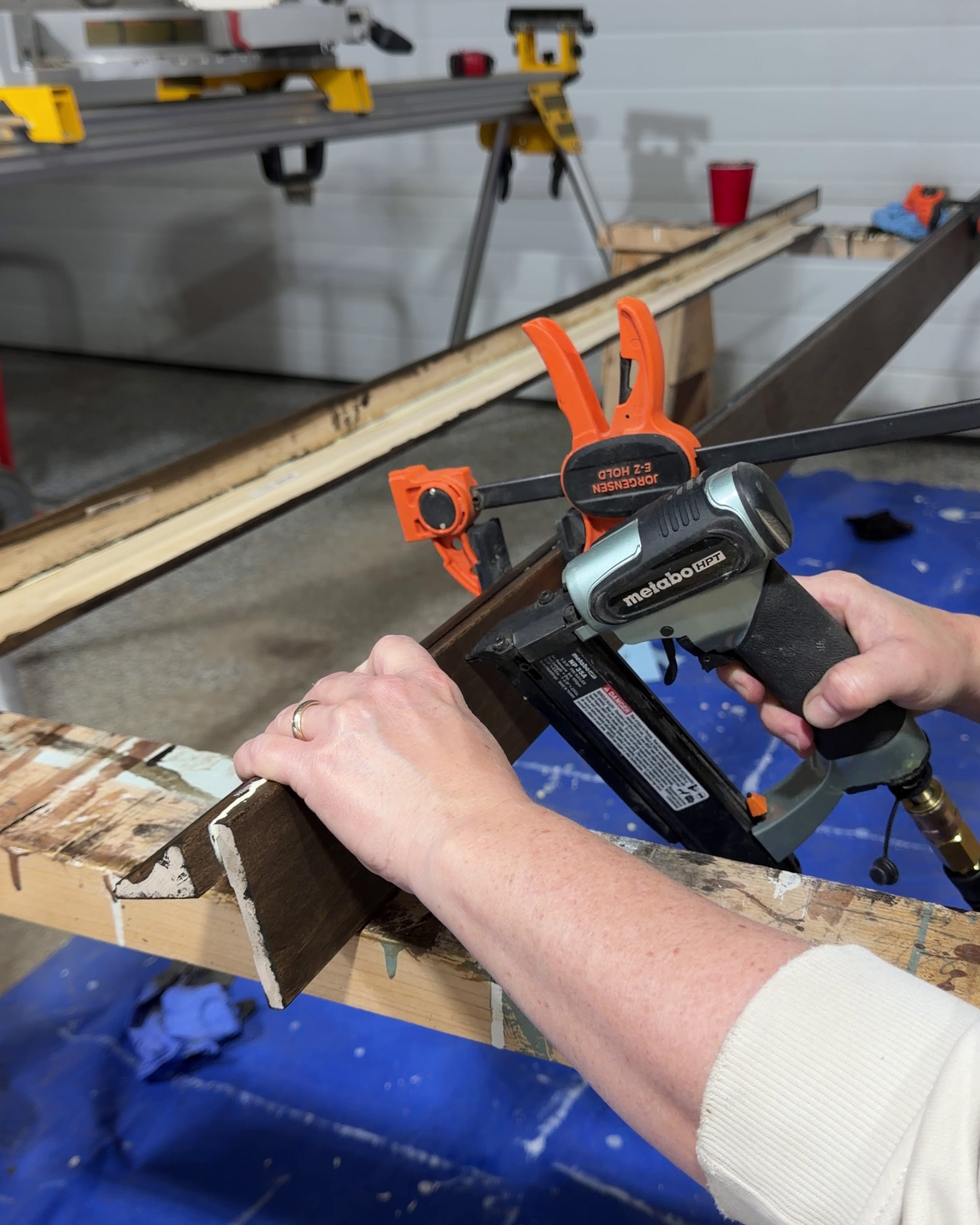attaching two pieces of trim with nail gun