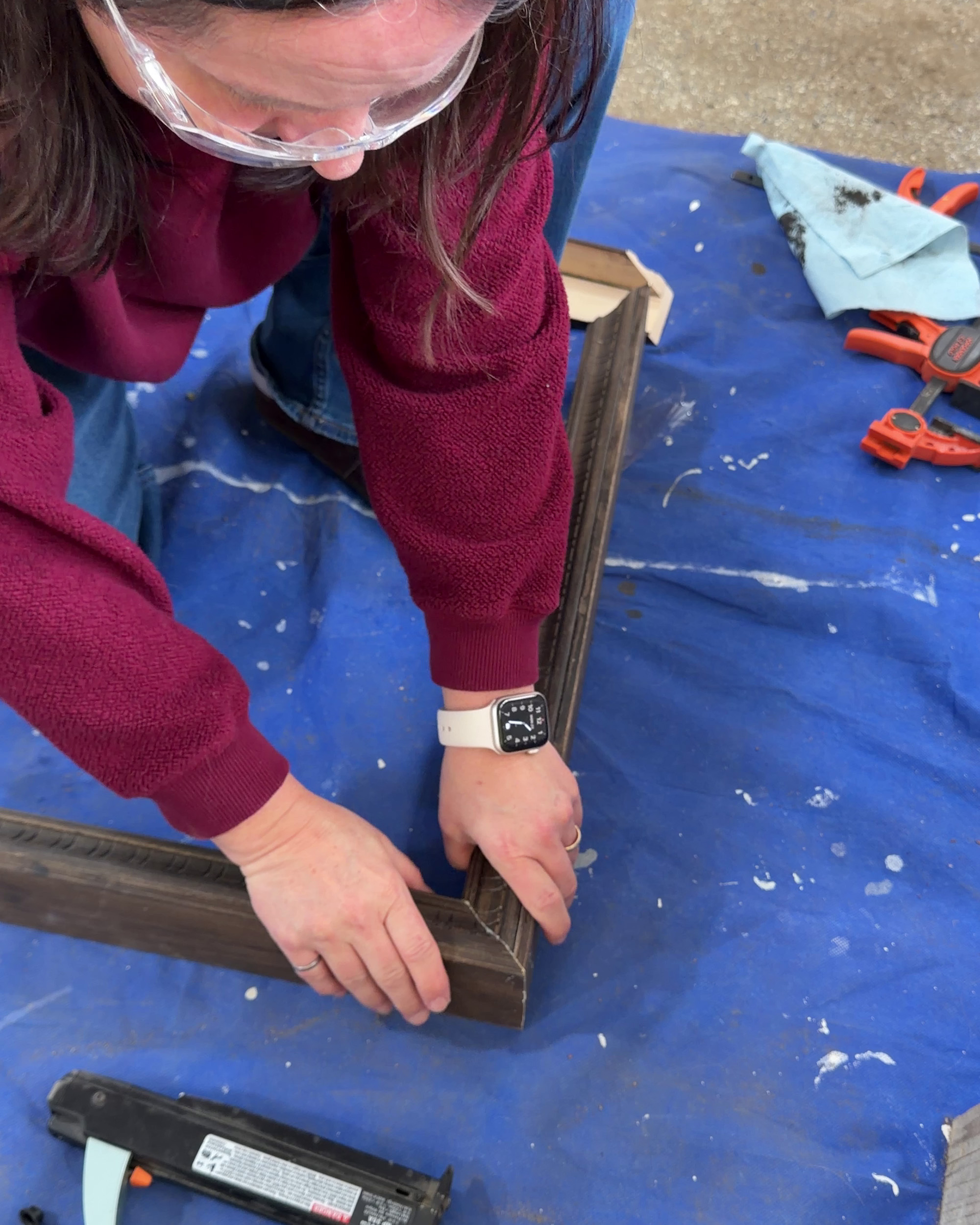 holding a mitered corner of a frame together