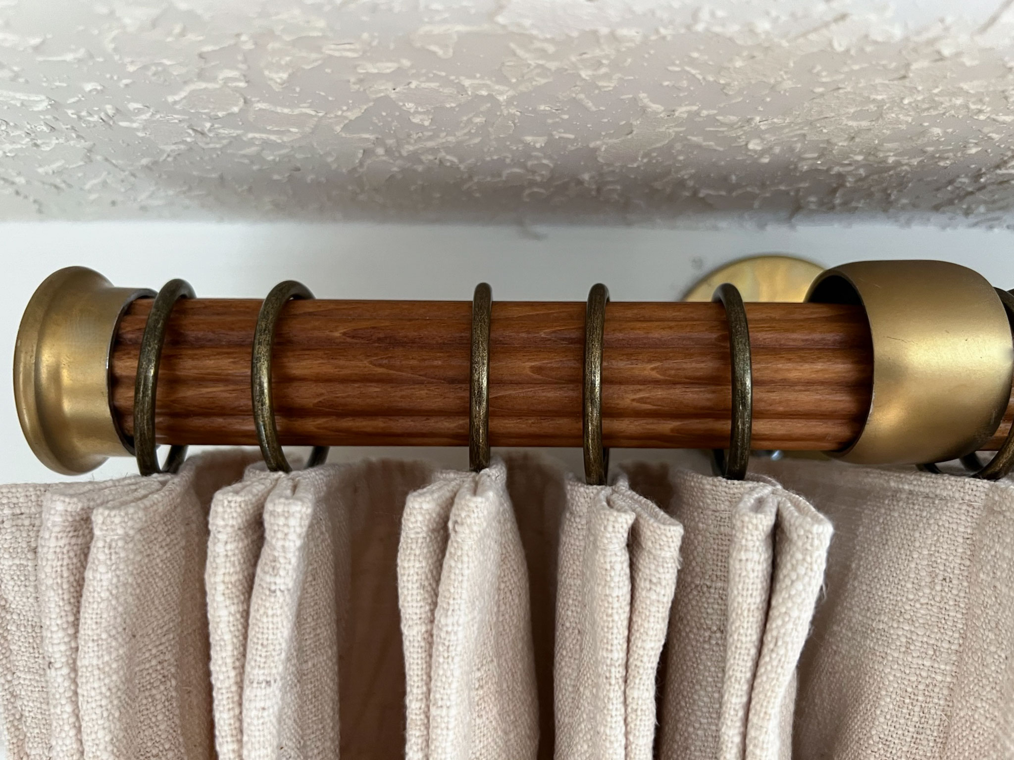 Curtain rod with rings and curtain installed