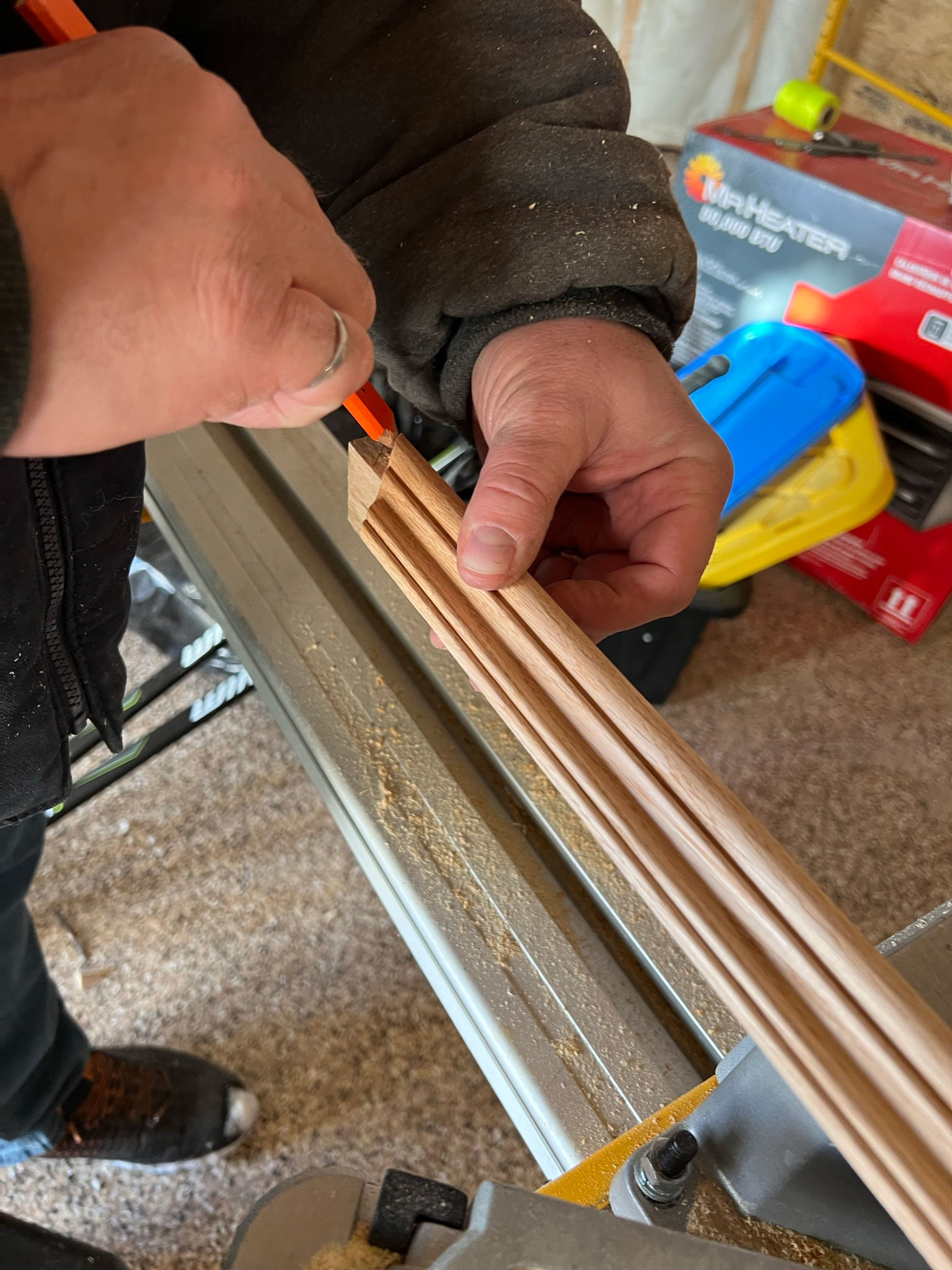 marking a cut on a piece of wood using another