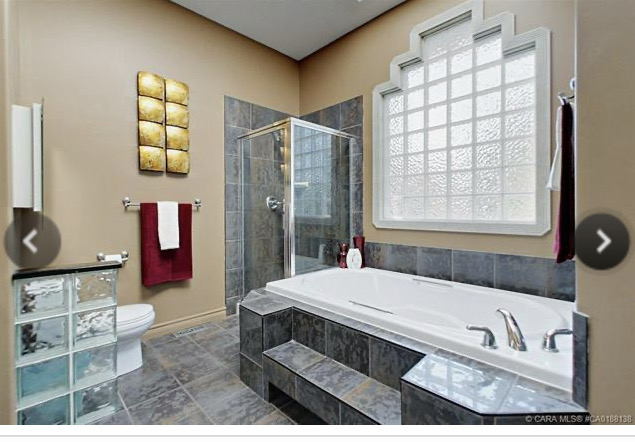 Dated bathroom with glass block window ensuite