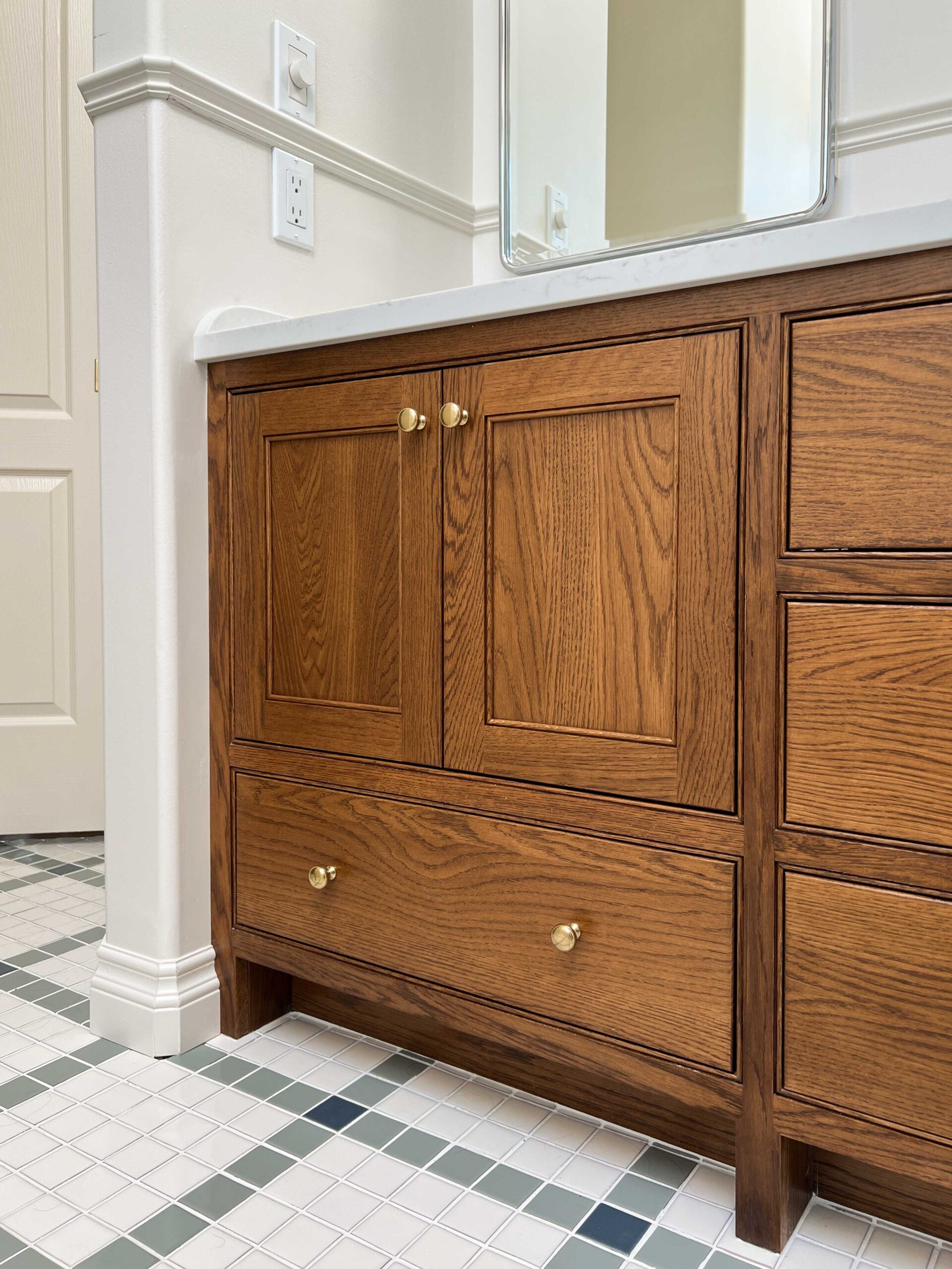 Custom oak vanity with brass knobs, inset doora and extend legs