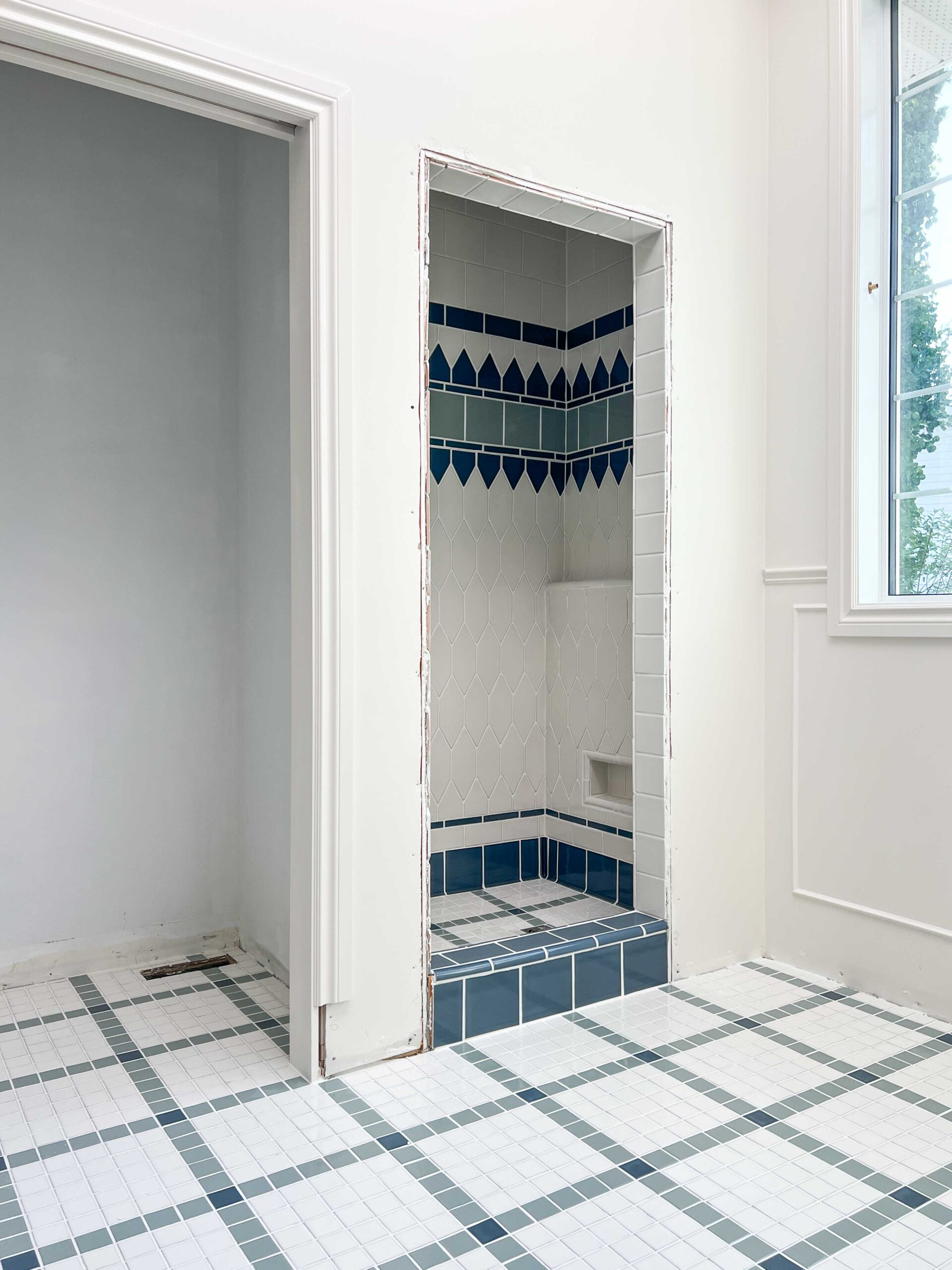 Historic tile pattern on floor and shower with fireclay tile