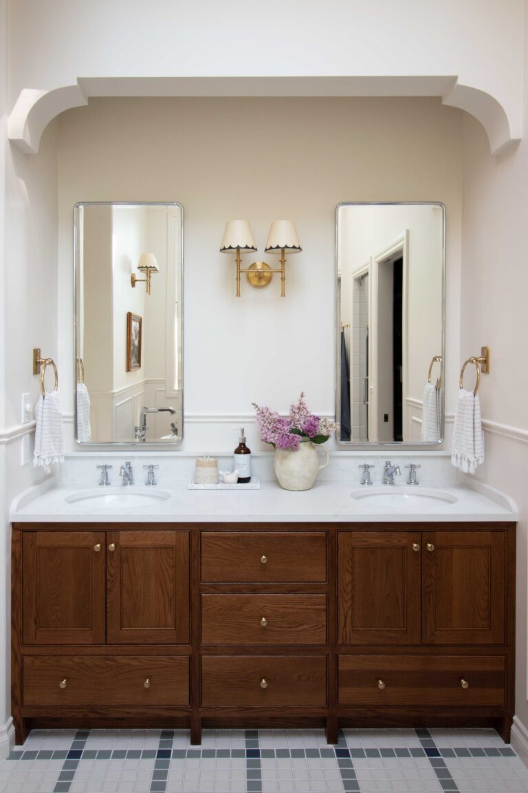 Oak bathroom double vanity with quartz top and two chrome mirrors, chrome fixtures, plaid tile floor