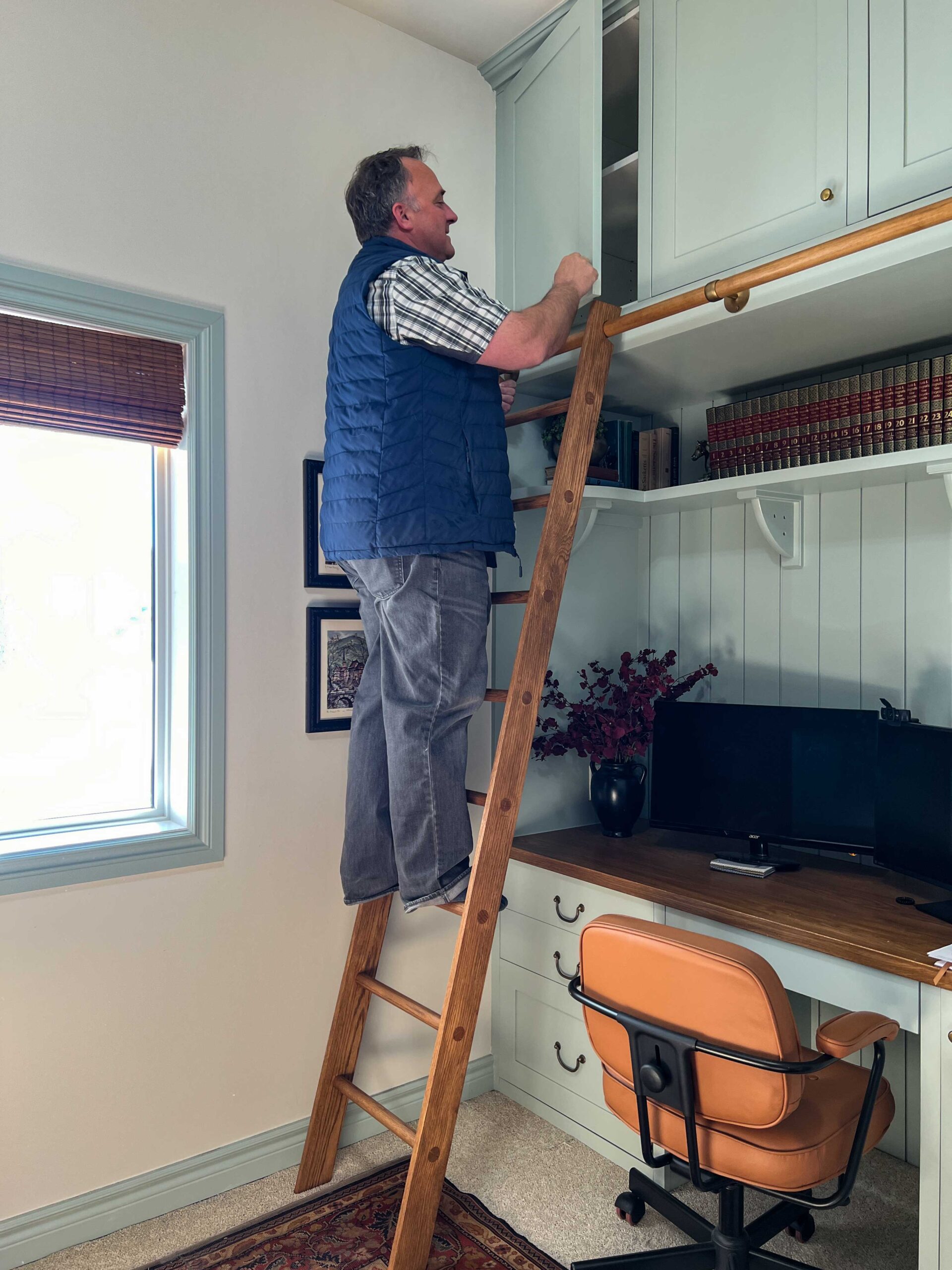 Man standing on DIY wood ladder