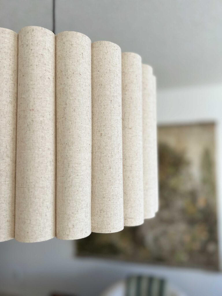 close up of scalloped linen light fixture