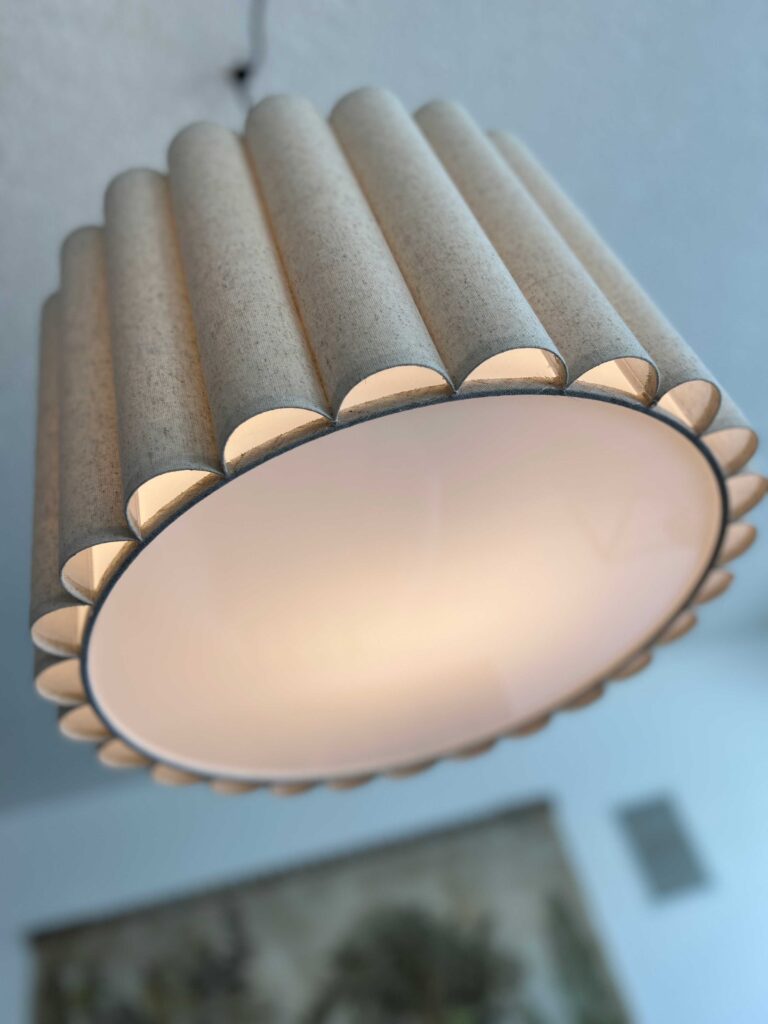 close up of scalloped linen light fixture