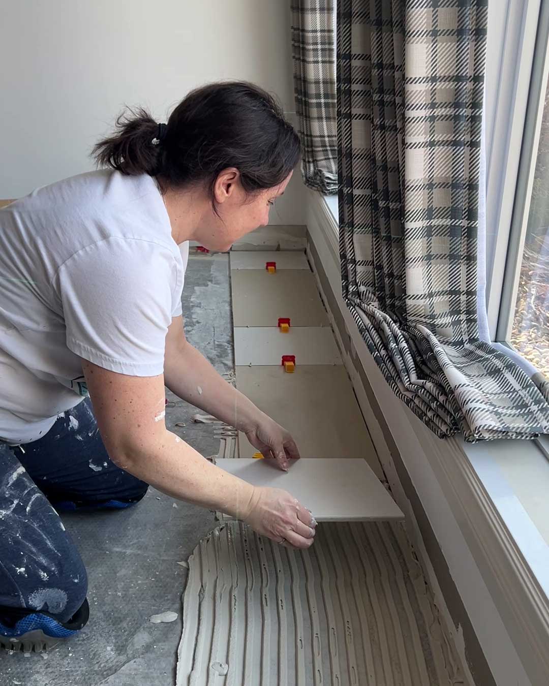 Installing the first row of tile