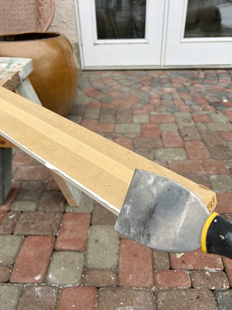 scraping caulking off the back of baseboards
