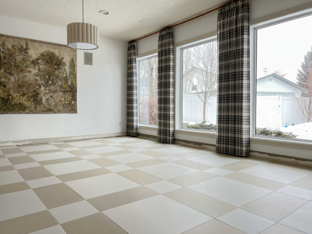 living room with large format tile installed and curtains